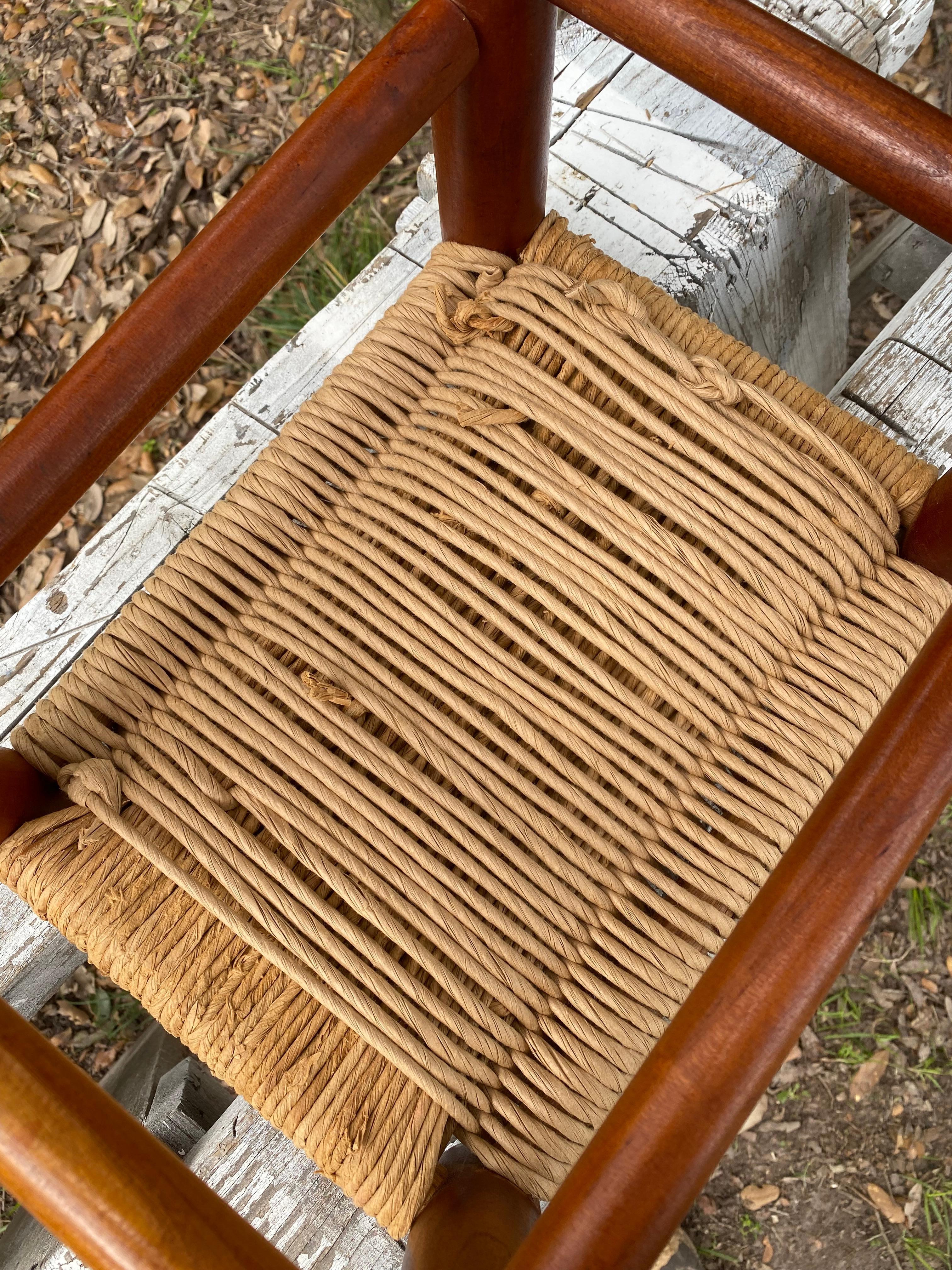 This primitive-style woven rush footstool is a beautiful blend of rustic charm and timeless craftsmanship. Featuring a sturdy wooden frame with a rich, natural finish, this piece adds warmth and texture to any space. The woven rush seat provides a