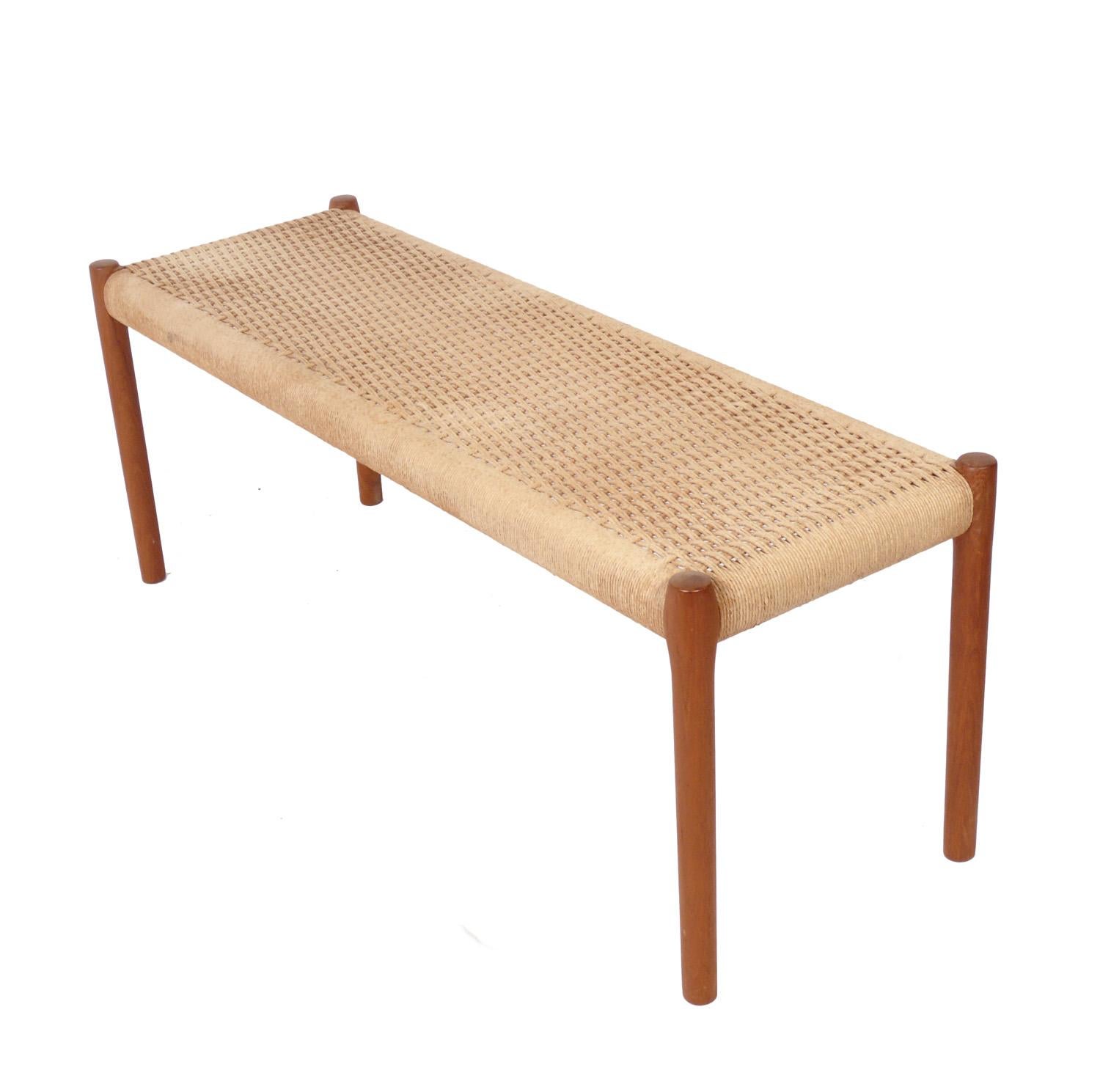 Danish modern woven rope seat and teak bench, Denmark, circa 1960s. Retains warm original patina.