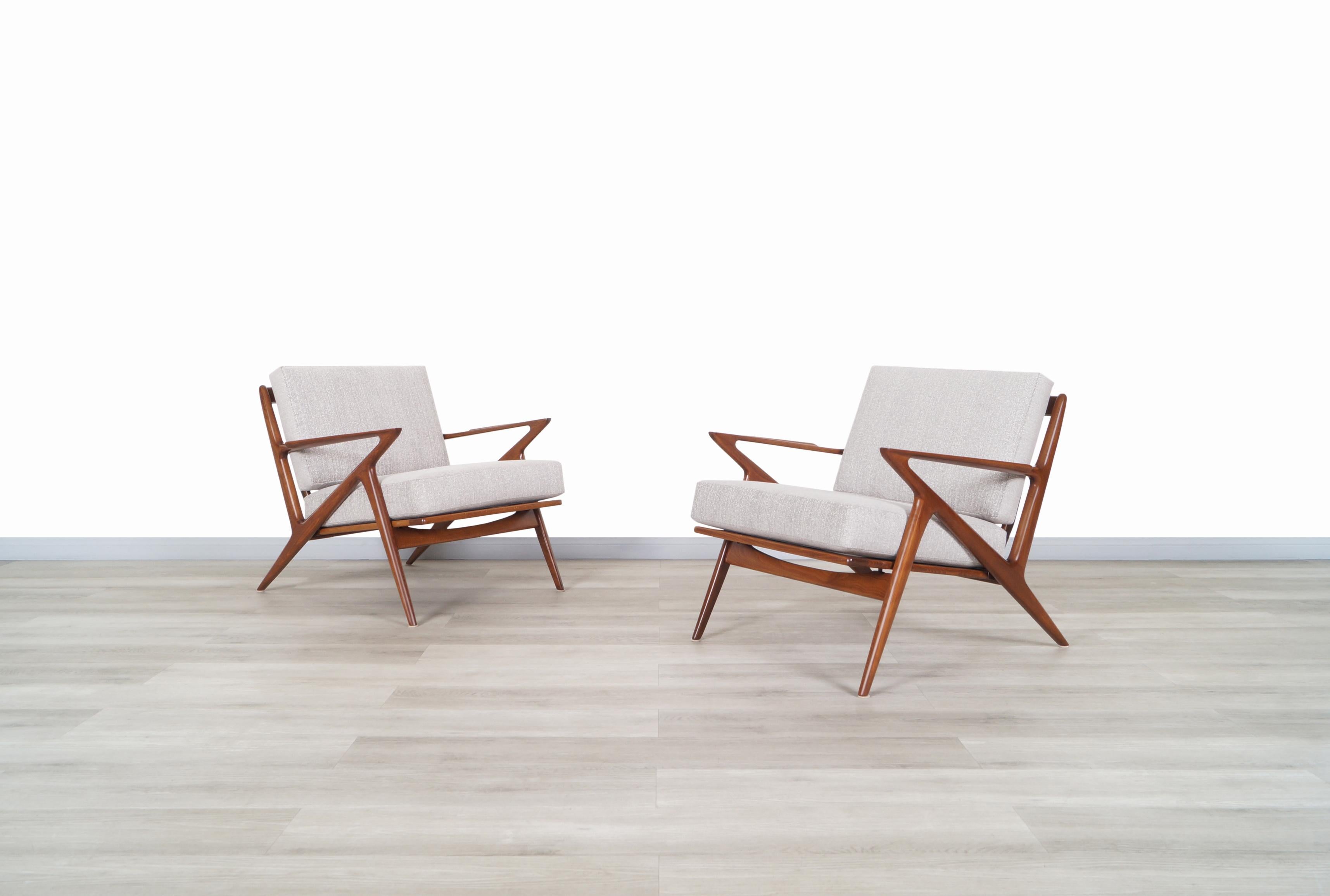 Stunning pair of Danish modern lounge chairs designed by Poul Jensen for Selig in Denmark, circa 1960s. Known as the “Z” chair for its exclusive armrests that connect to the legs and give the illusion of a letter Z. These chairs stand out for the