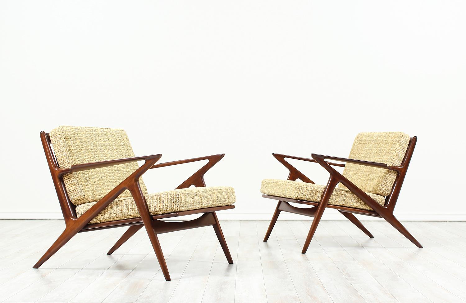 A pair of classic lounge chairs designed by Poul Jensen for Selig in Denmark circa 1960s. Known as the “Z” lounge chair for its signature armrests that connect to the legs, which resembles the letter Z. This iconic pair features a solid