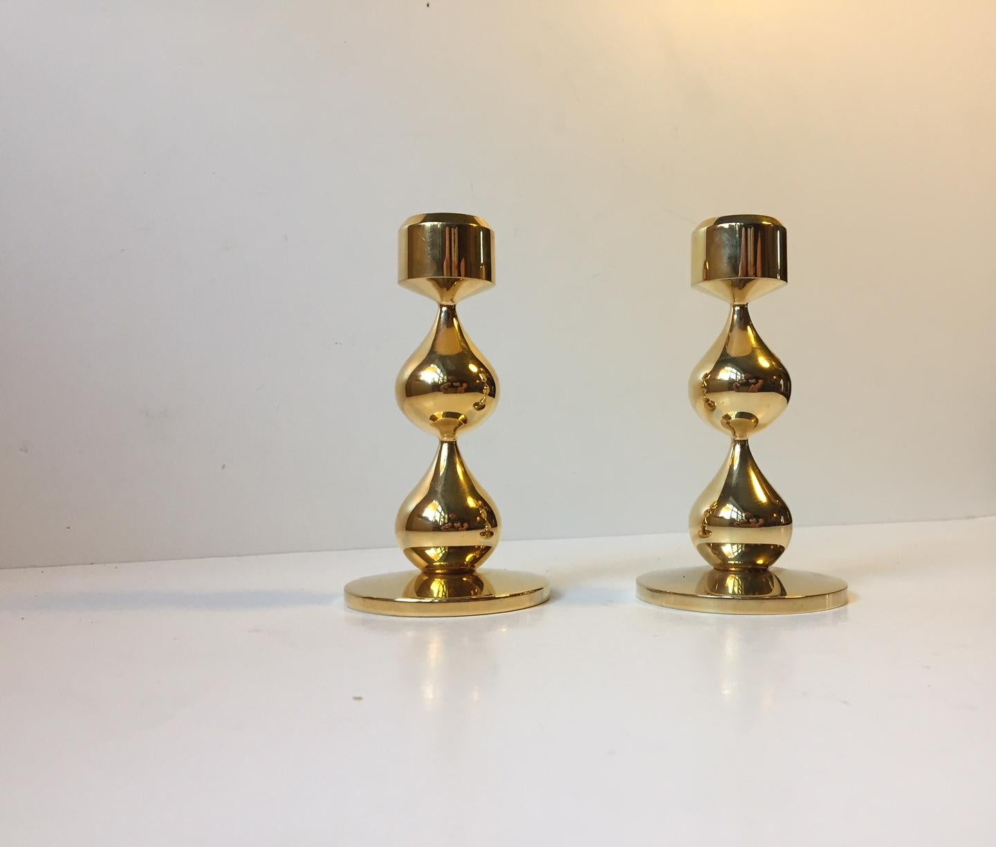This set of organically-teardrop shaped 24-carat gold-plated candleholders was designed by Hugo Asmussen. The pieces were manufactured by Asmussen in Denmark in the 1960s. Candle size: regular.