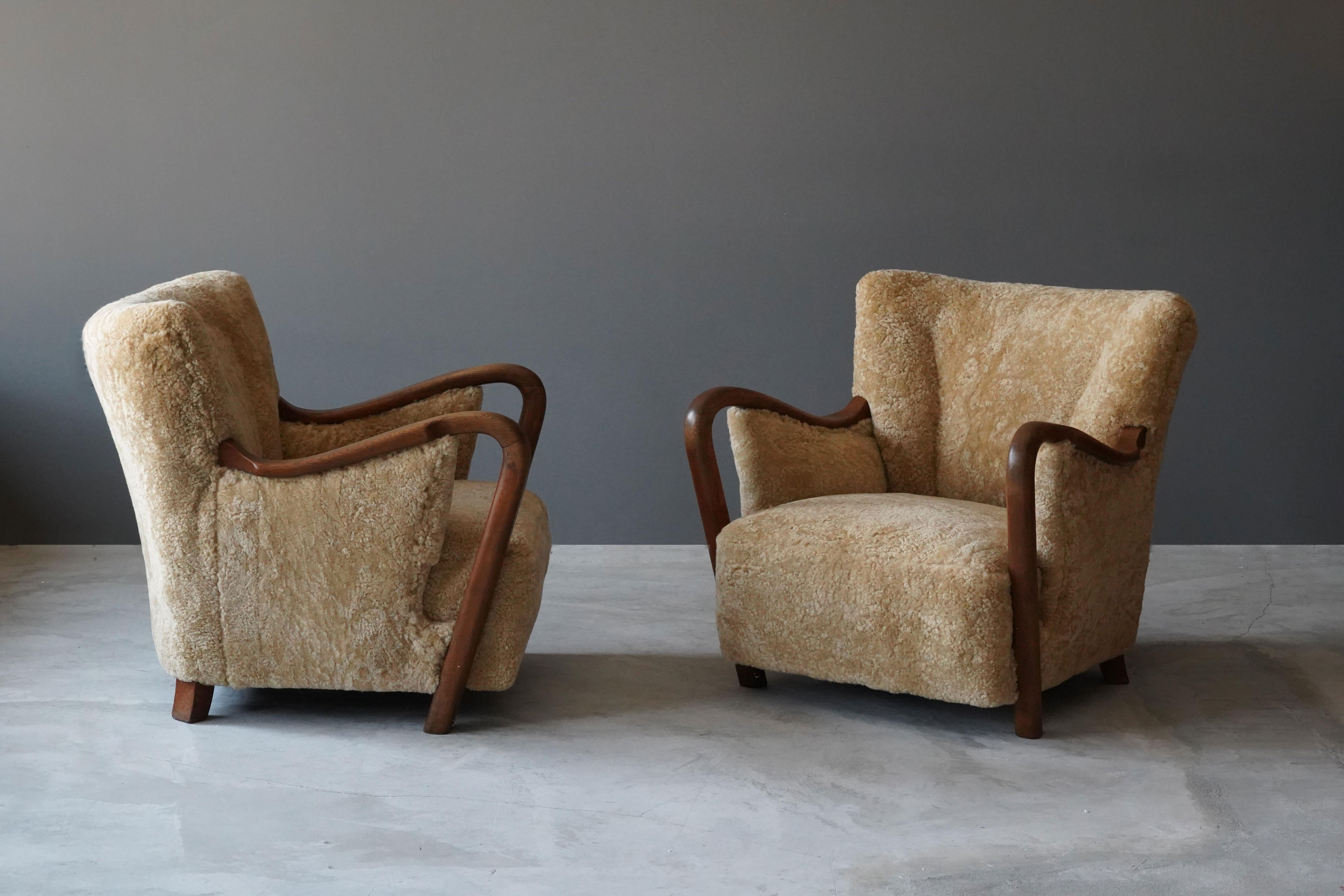 Scandinavian Modern Danish Modernist Designer, Lounge Chairs, Sheepskin, Stained Beech Denmark 1940s