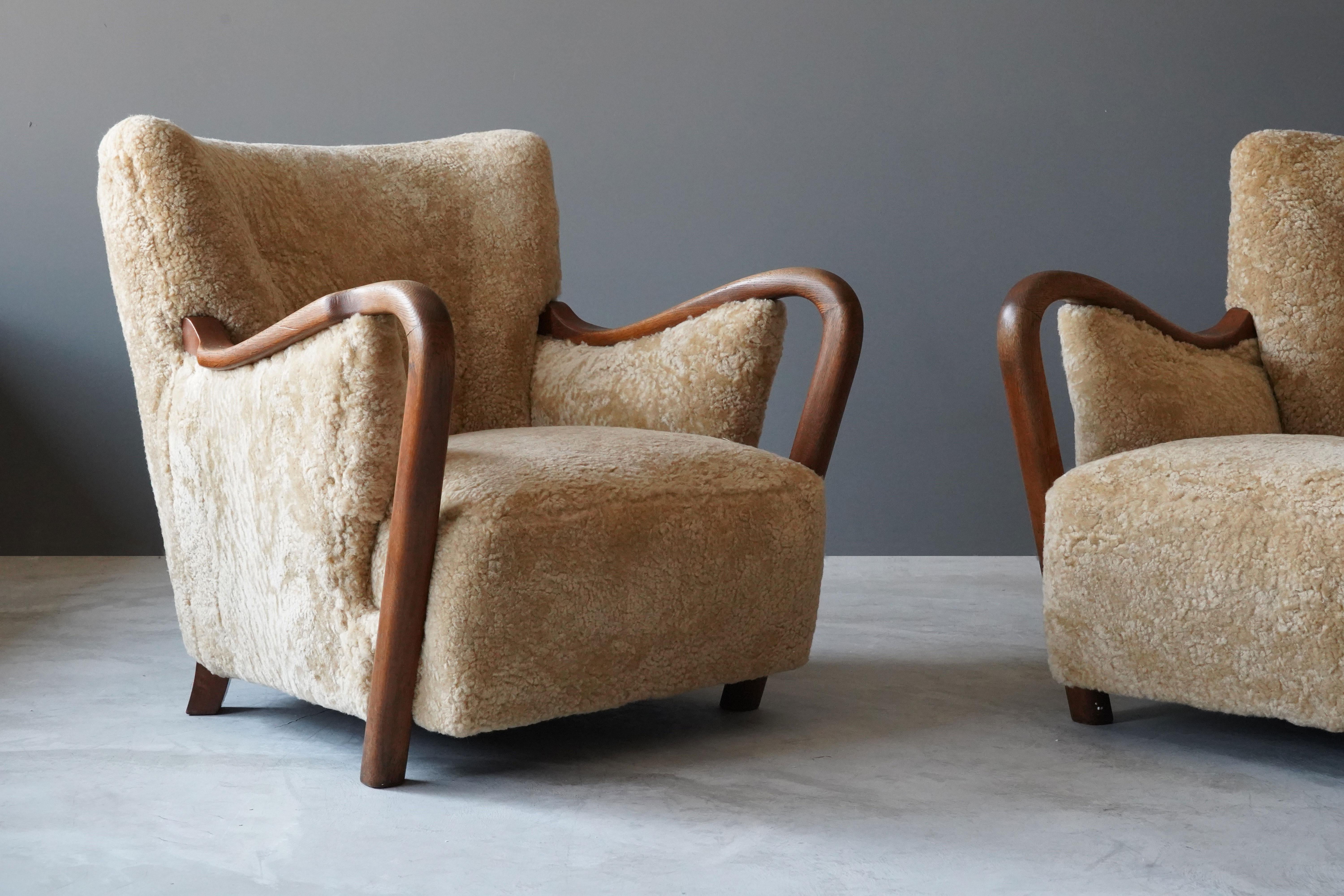 Mid-20th Century Danish Modernist Designer, Lounge Chairs, Sheepskin, Stained Beech Denmark 1940s