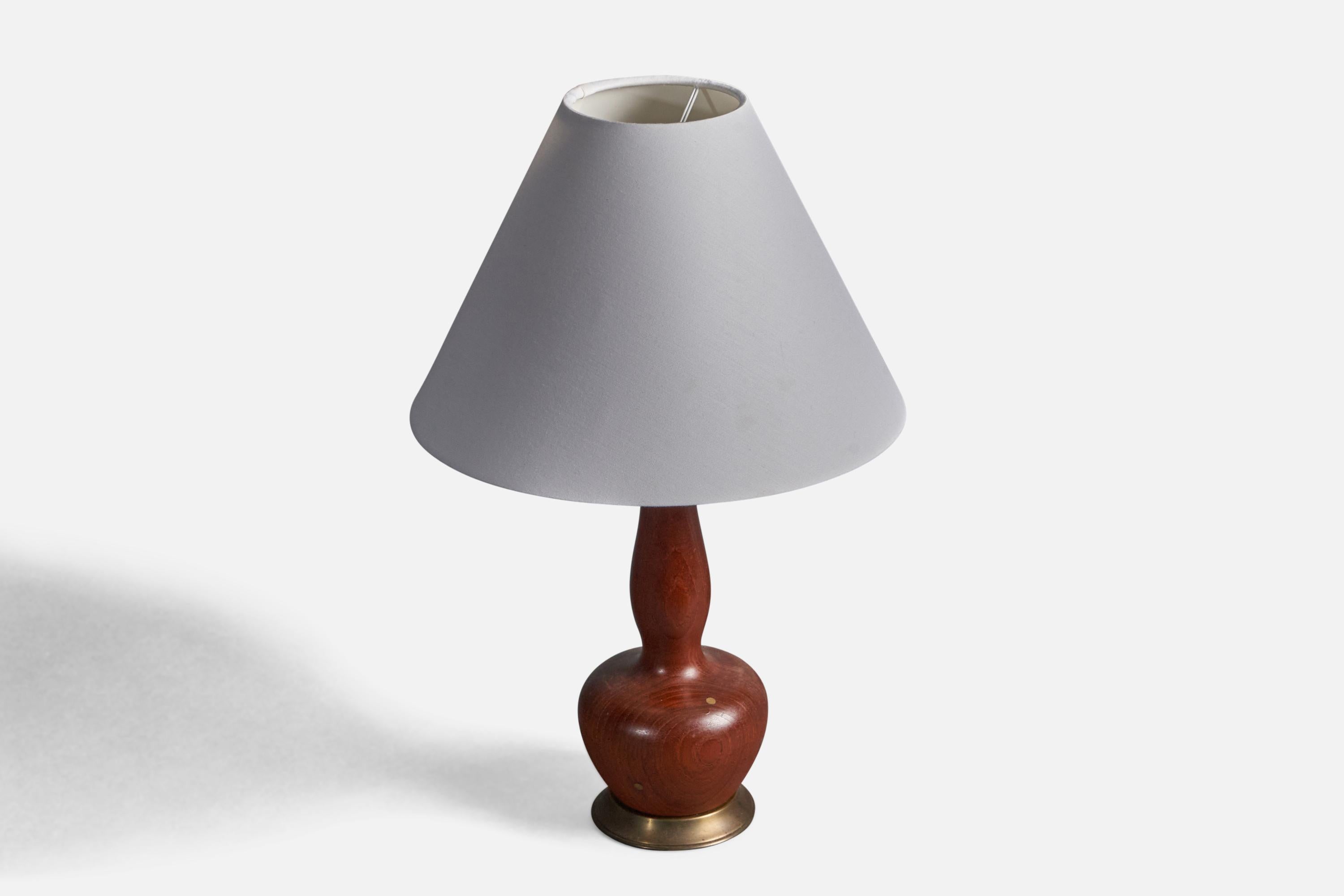 An organic table lamp. In solid teak, with superb brass inlays adding further appeal. 

Stated dimensions exclude lampshade. Height includes socket. Sold without lampshade.

Other designers of the period include Finn Juhl, Hans Wegner, Kaare Klint,