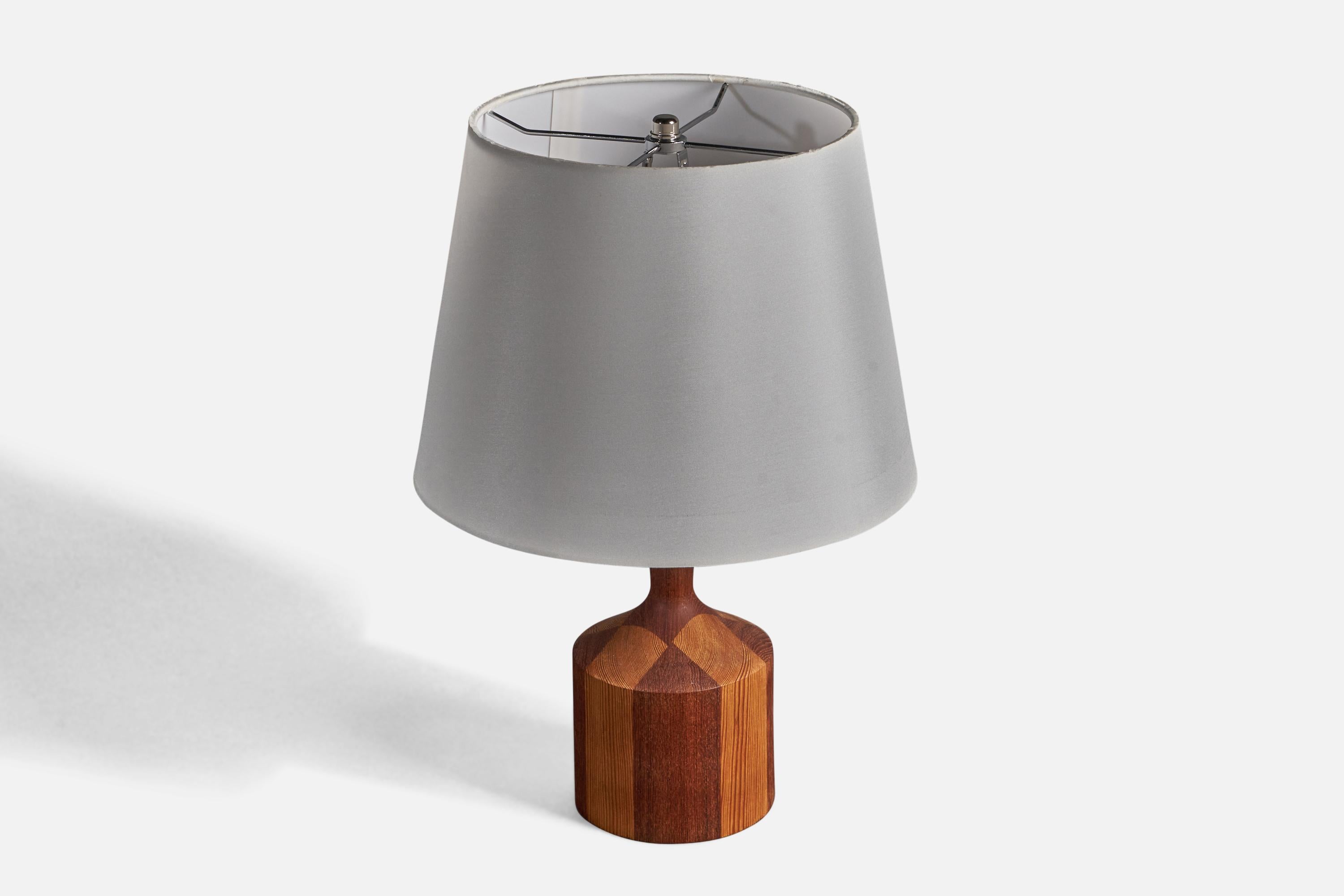 A table lamp. In solid teak and pine. 

Stated dimensions exclude lampshade. Height includes socket. Lampshade is not included in purchase.

Other designers of the period include Finn Juhl, Hans Wegner, Kaare Klint, Alvar Aalto, and Paavo Tynell.