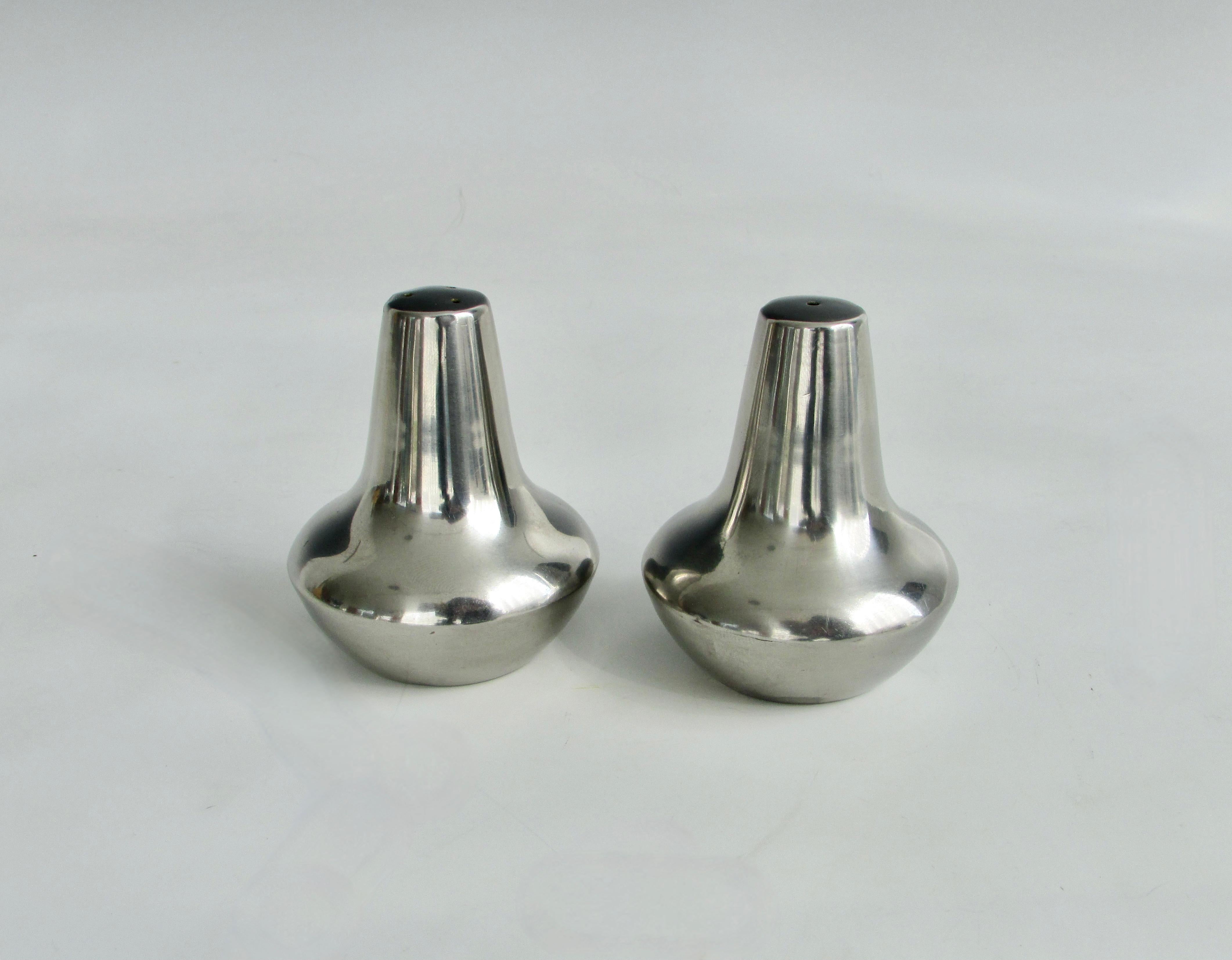 Pair of bulbous based modernist salt and pepper shakers. Marked 18/8 stainless steel Denmark.