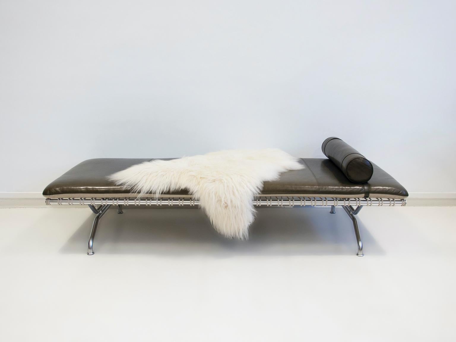 Daybed, model GD3, designed by Karsten Gransgaard and produced by Gransgaard Design. Label underneath. Matte chromed steel frame, cushion in dark green/brown aniline leather, removable neck pillow. Display model with minimal signs of wear. Lambskin
