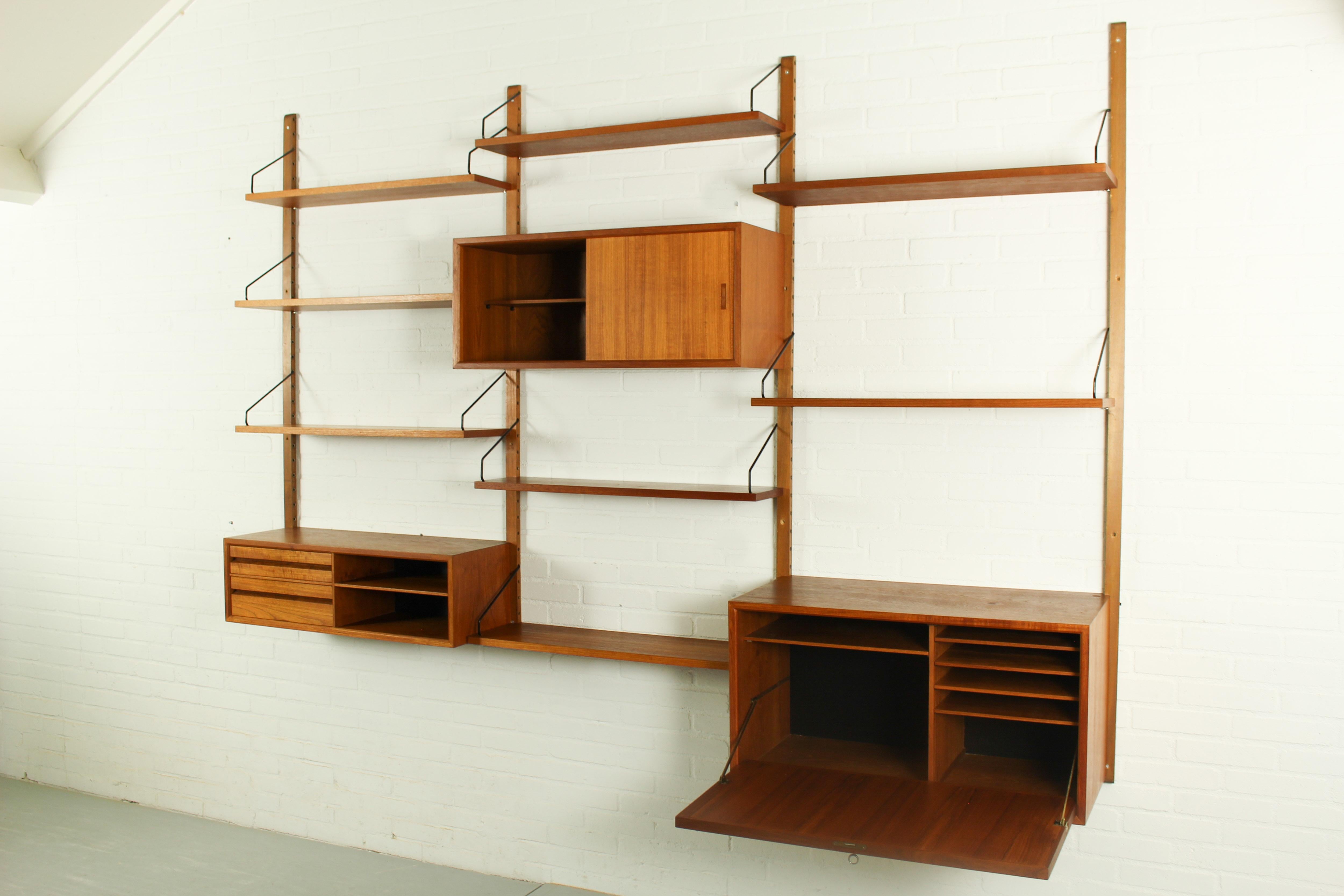 Shelving system in teak designed by Poul Cadovius for Cado, Denmark. This 