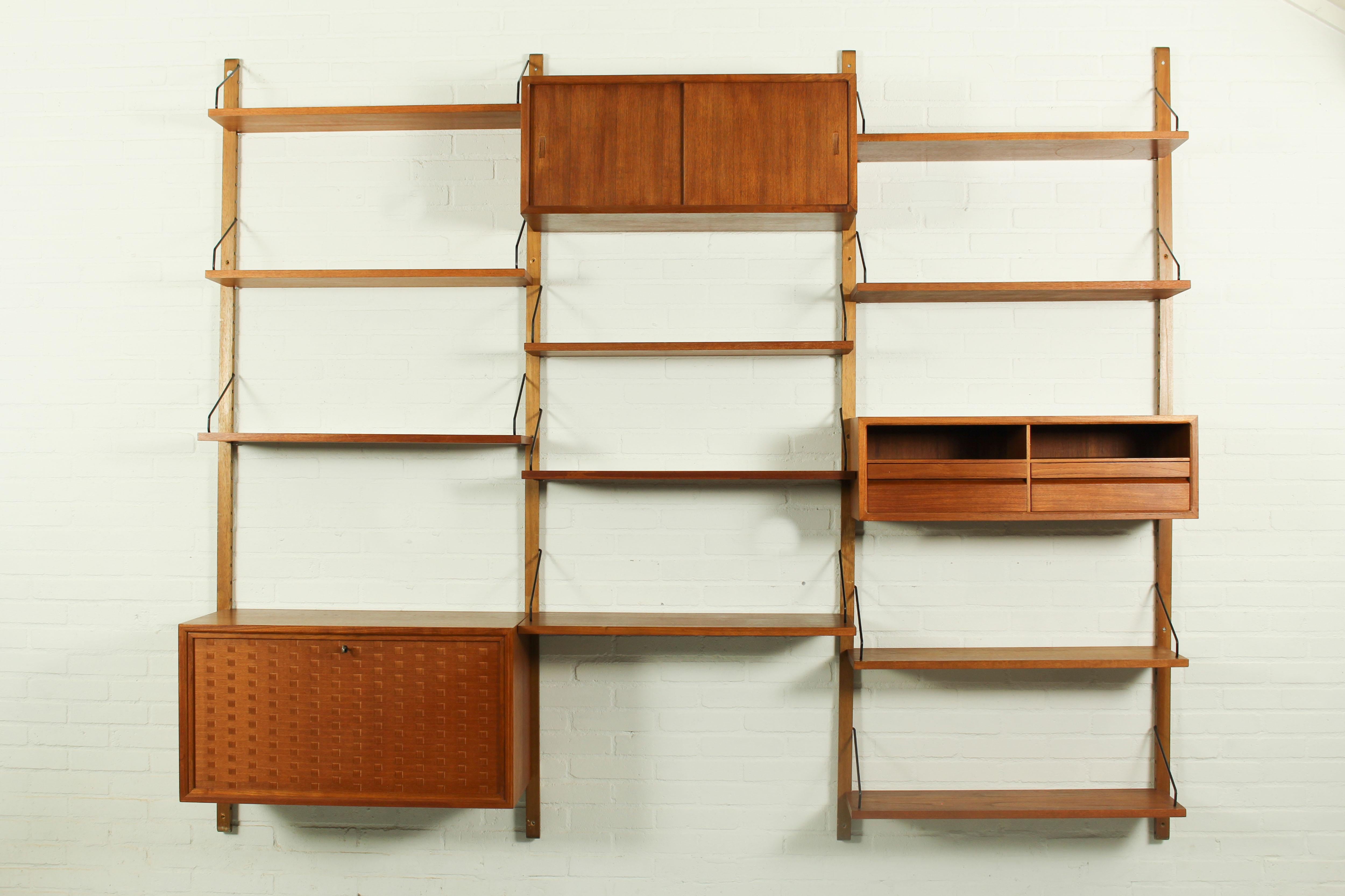 Shelving system in teak designed by Poul Cadovius for Cado, Denmark. This 