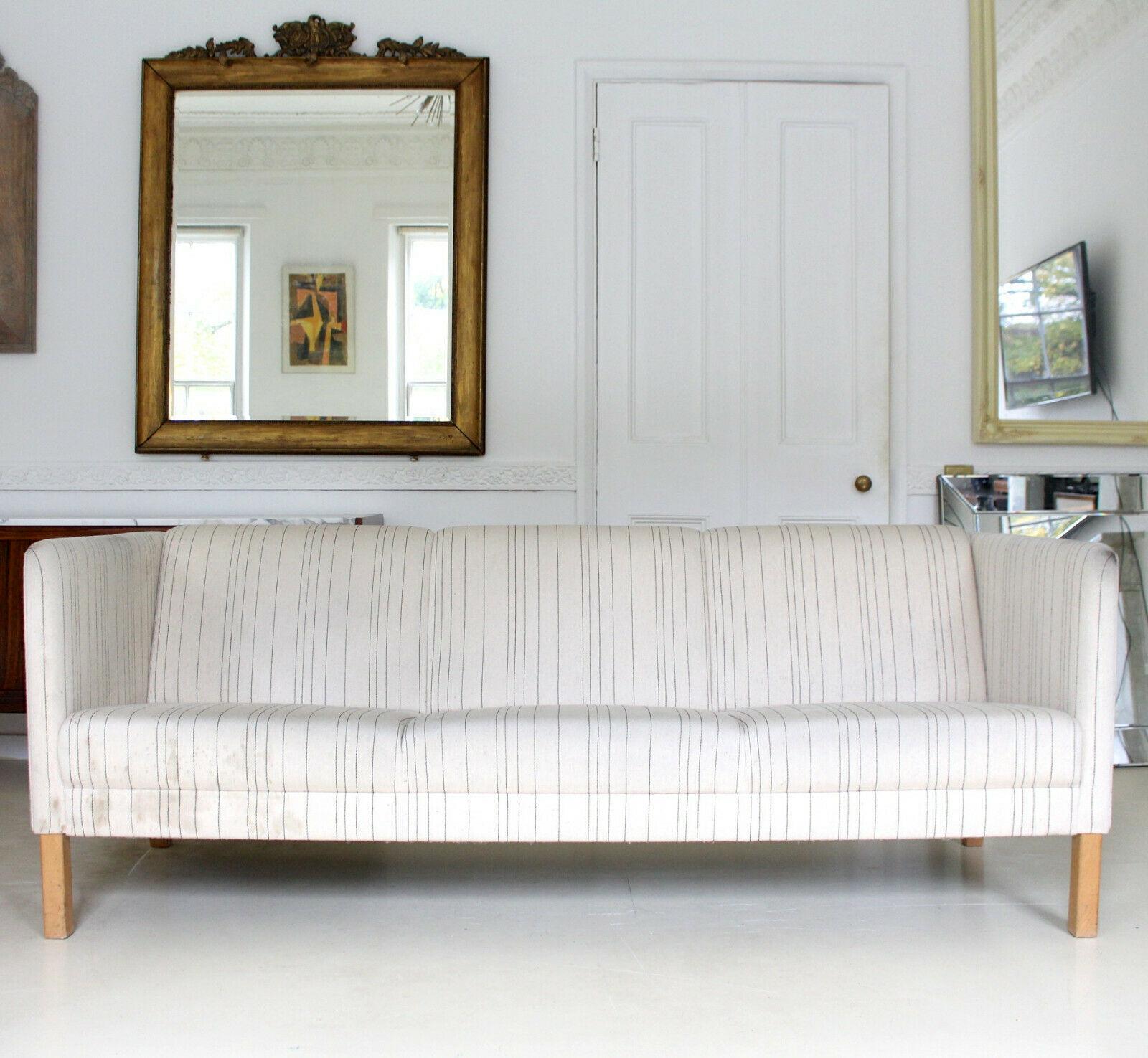 An attractive vintage Danish large three-seat sofa.

Upholstered in excellent quality pin stripe wool.

Offered in very good structural condition, some light wear and marks to upholstery which should clean out.

Denmark, late 20th century.