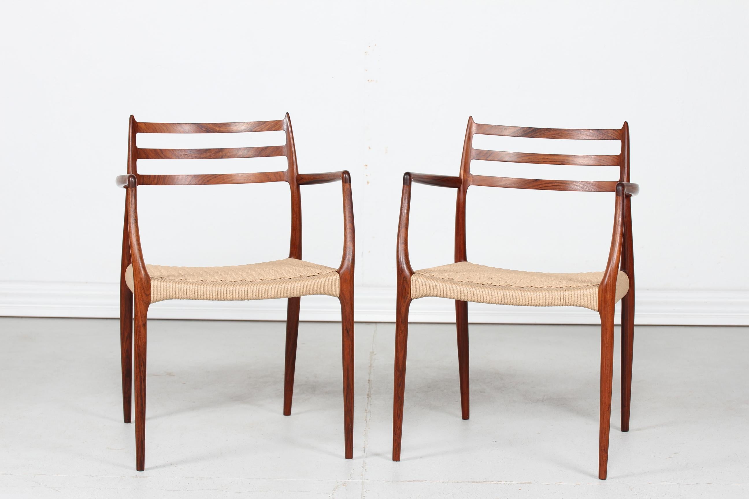 Here is a pair of armchairs model no. 62 designed by the Danish cabinet maker and furniture designer Niels Otto Møller (1920-1982) 
They are manufactured in the 1960s by J. L. Møllers Møbelfabrik, Aarhus in Denmark.

The rosewood armchairs have