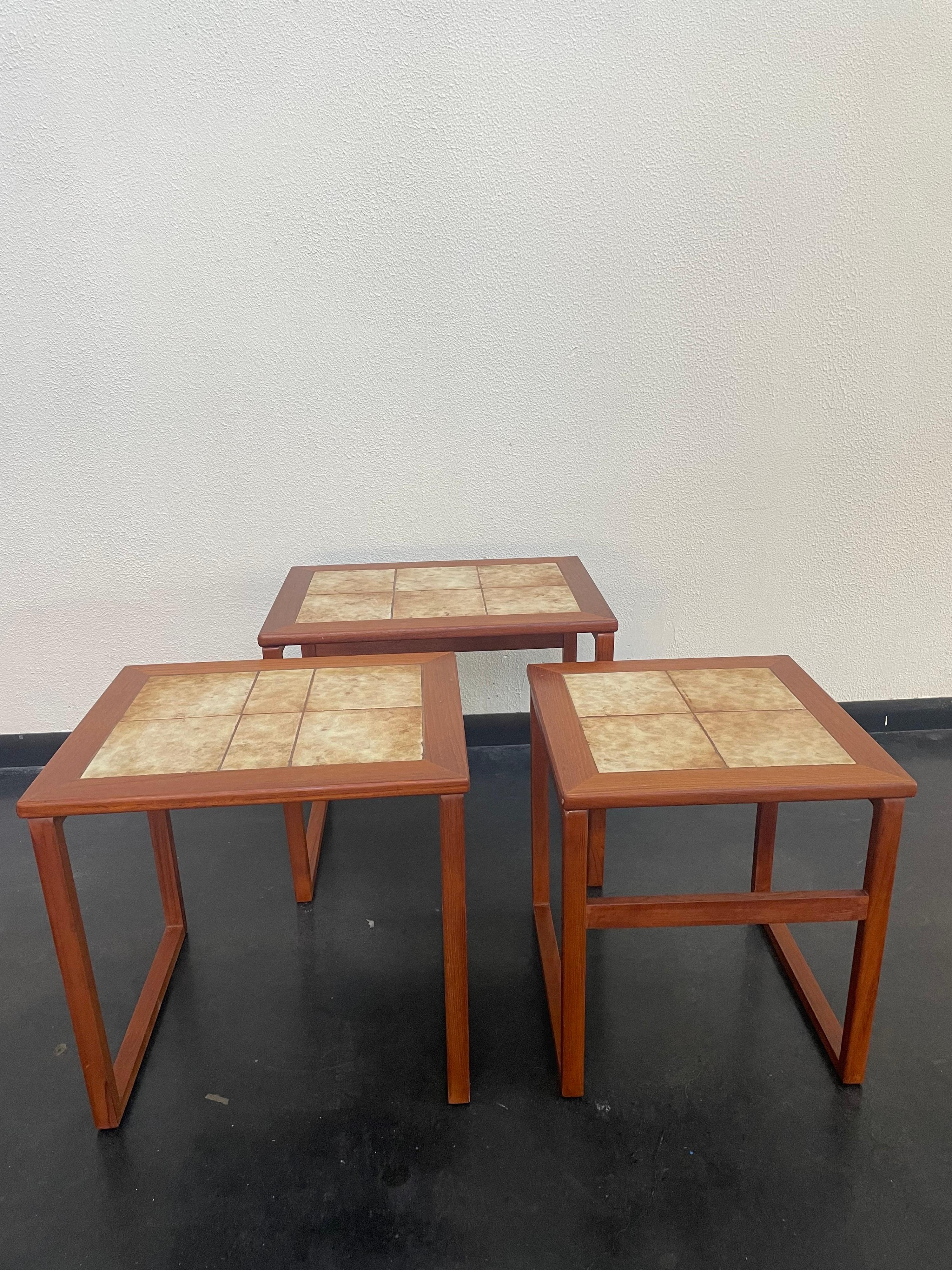 1960s Mid-Century Modern Danish nesting tables with ceramic tile top.