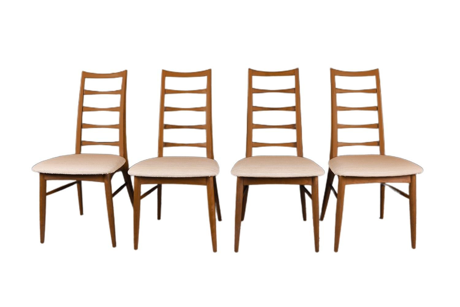 An outstanding set of six teak dining chairs designed by Niels Koefoed for Koefoeds Hornslet, model “Lis” made in Denmark, circa 1960s. This stunning set of six ladder back teak chairs features two arm chairs and four side chairs in original