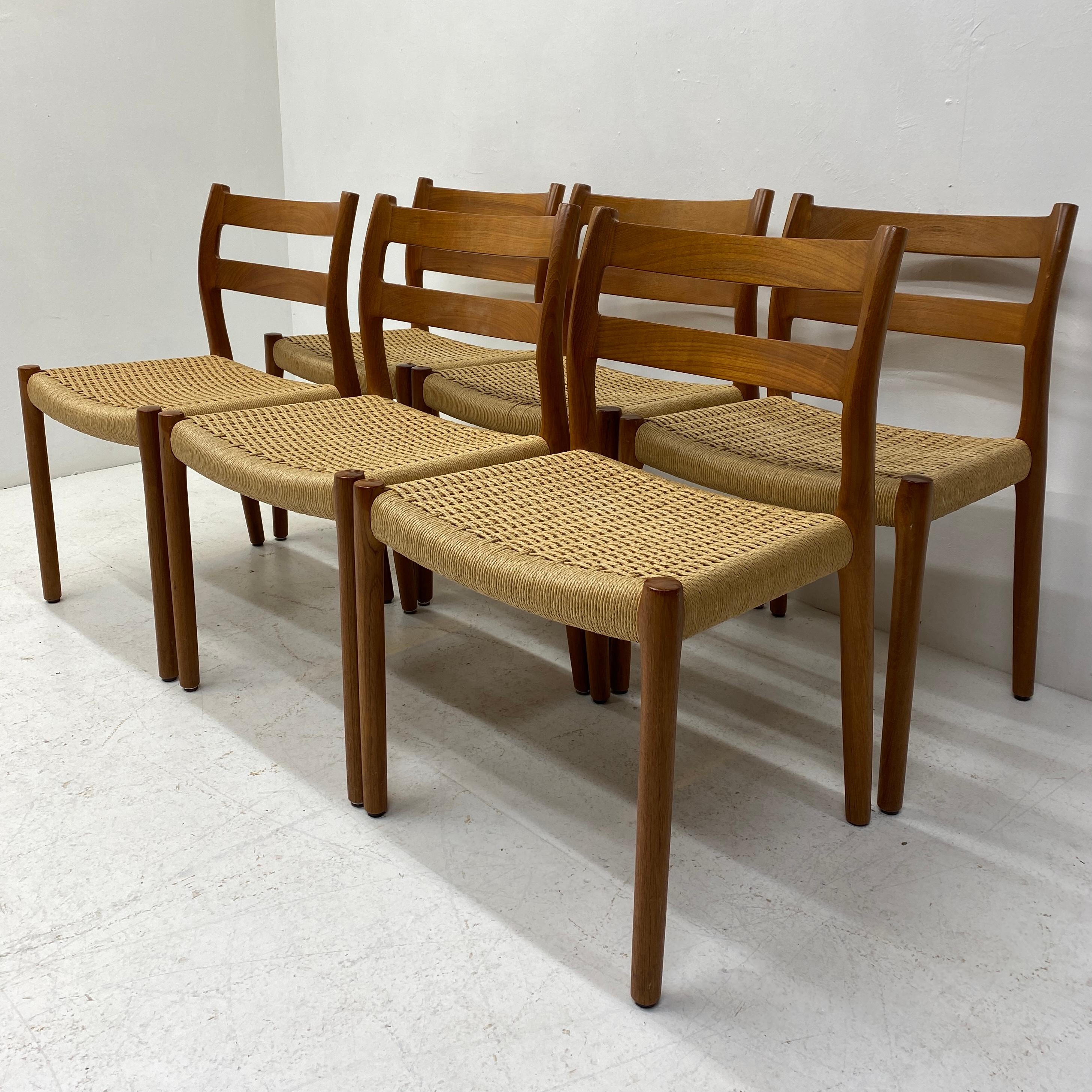 A stunning set of six Danish Niels Moller dining chairs circa 60s. The set features the rare model 84 that features organic & sculptural Danish design with solid teak frame, backrest & legs & papercord seats. The dining chairs are in beautiful