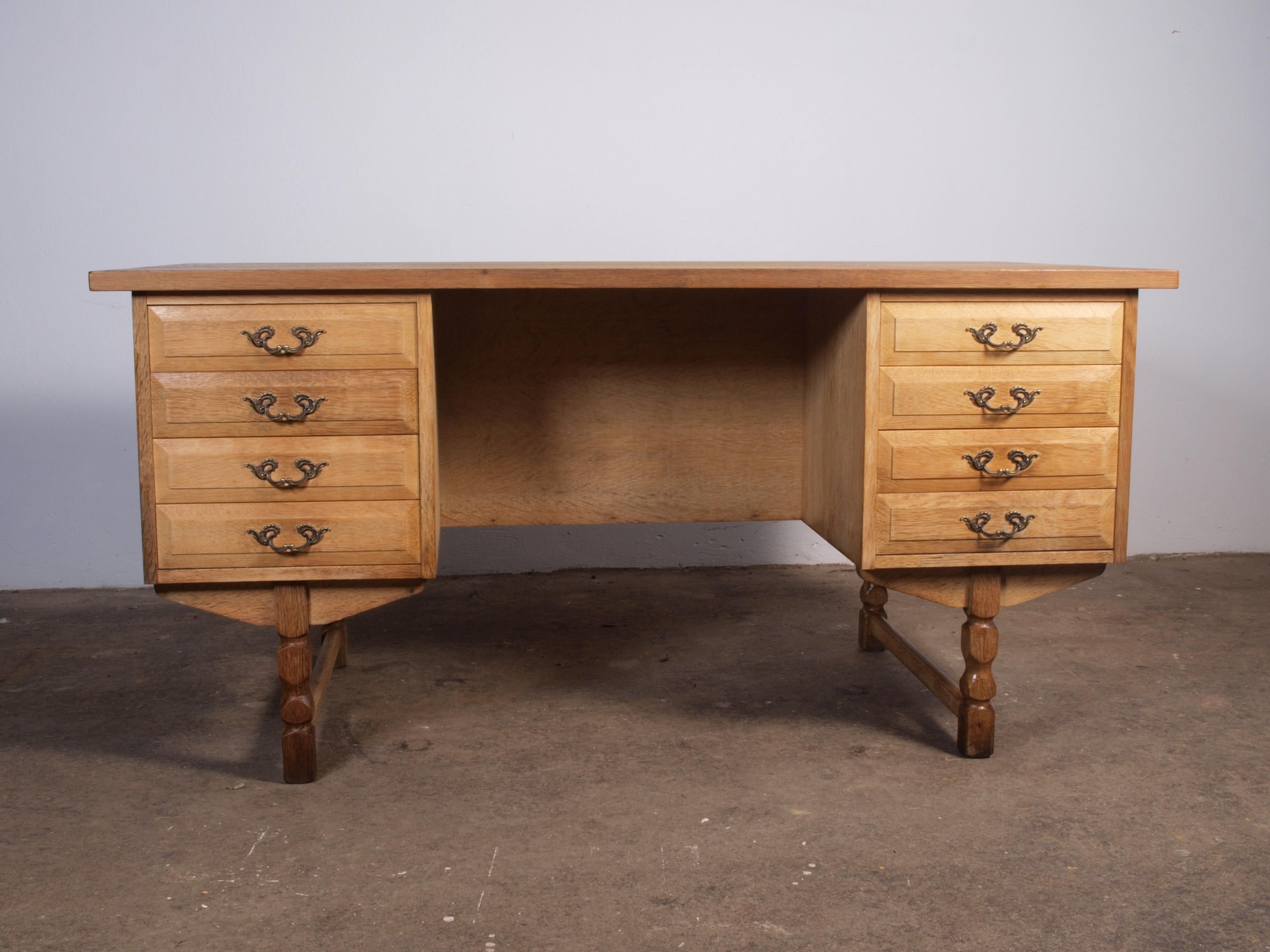 Solid oak writing desk complete with drawers, attributed to the Danish furniture designer Henning Henry Kjærnulf, a compelling piece. This creation harmoniously blends bold Baroque elements with the finesse of Mid-Century Modernism, resulting in a