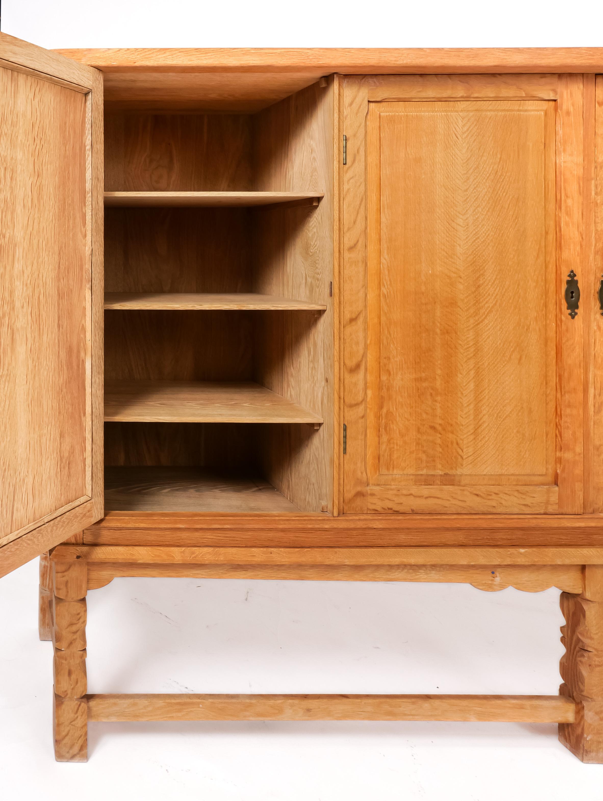 Carved Danish Oak Highboard cabinet by Henry Kjaernulf