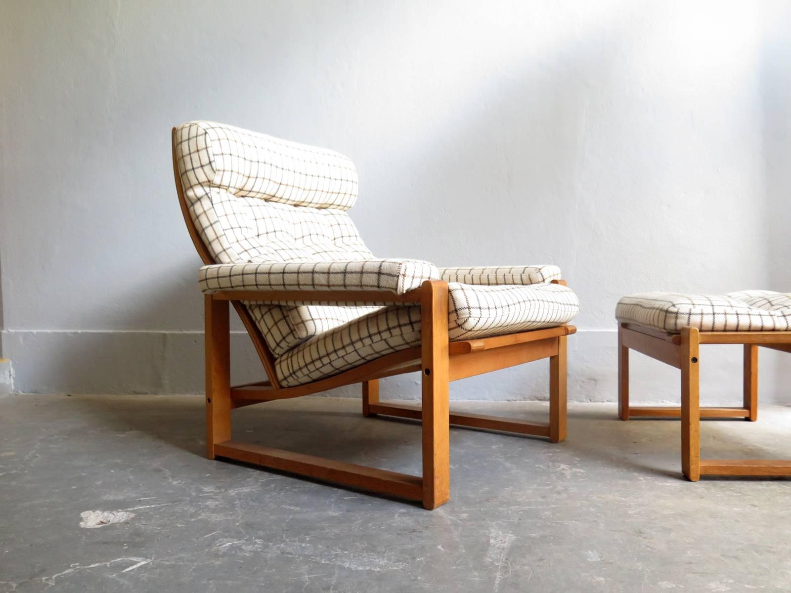 Danish oak lounge chair and ottoman with original fabric.