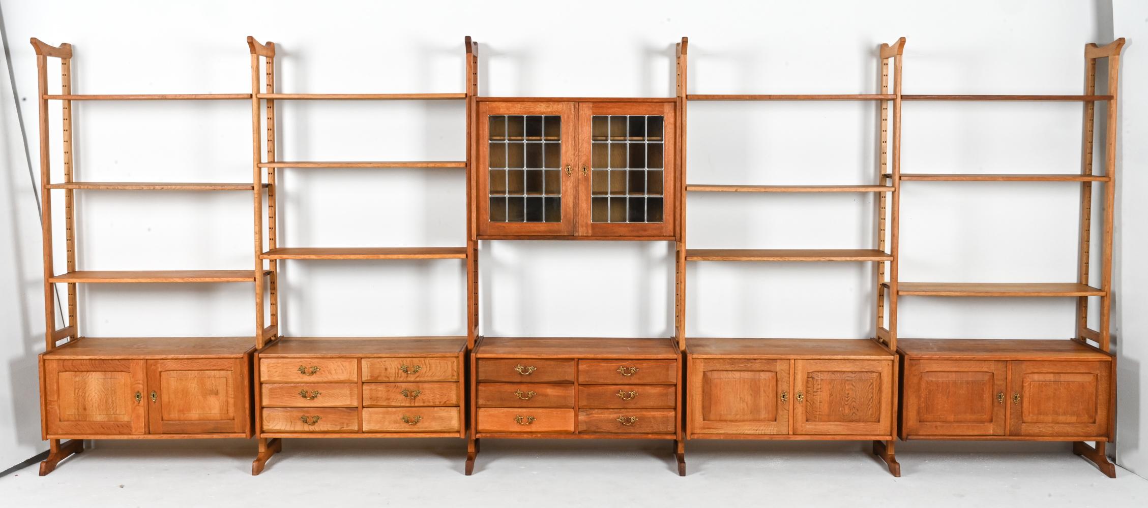 Includes: (10) free-standing vertical rails, (4) two-door cabinet units, (2) three-drawer cabinet units, (1) leaded glass cabinet unit, (13) shelves, and (2) keys. 

NOTE: Dimensions provided refer only to the cabinet with leaded glass doors, which
