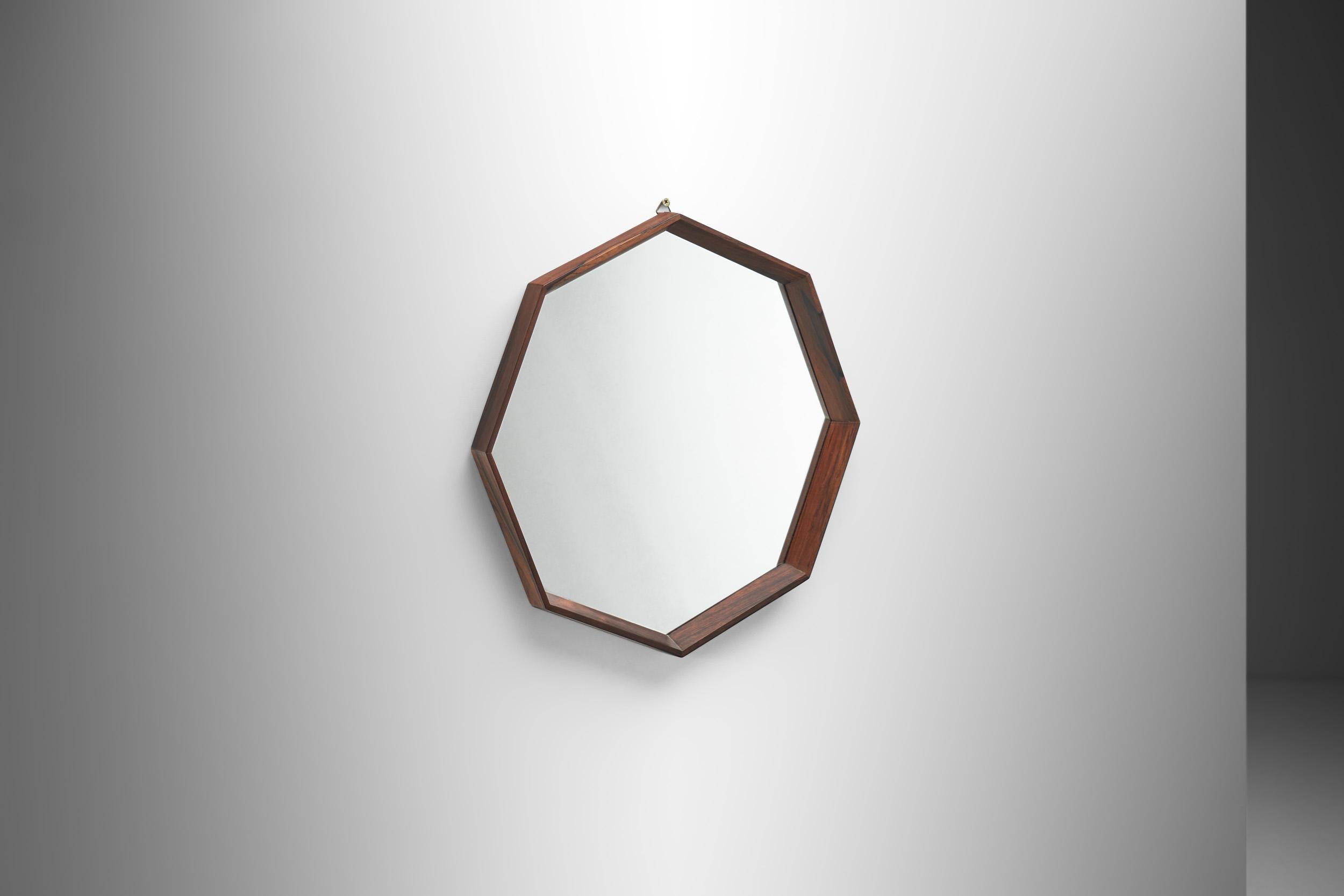 Mirrors are versatile pieces of interior décor with several functions and advantages; they create depth, increase light coverage, and add a statement to any space. This octagonal Danish accent mirror is perfect to create a focal point in a