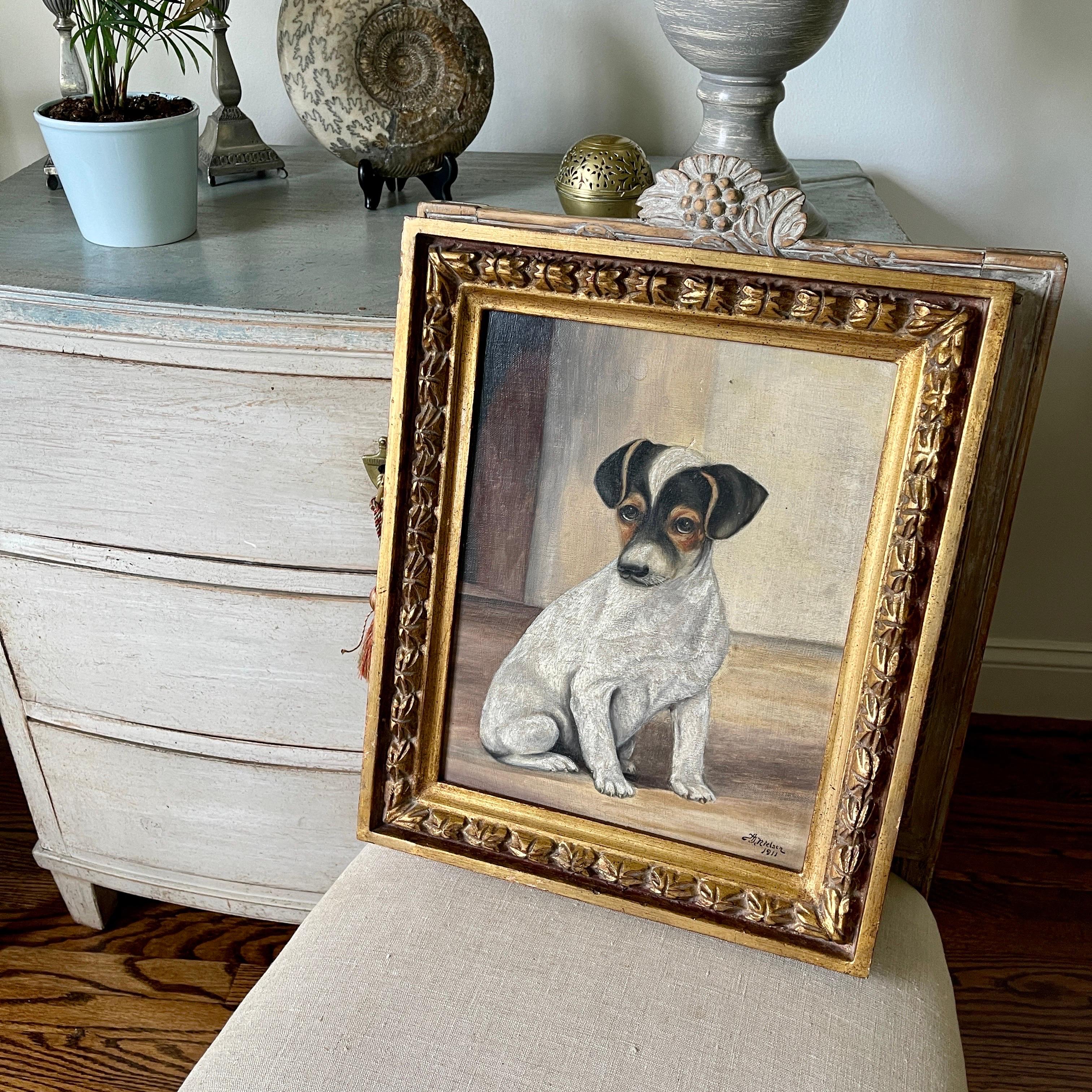 Amazing and Charming Painting of a Jack Russell Puppy Terrier, Denmark, Signed AJ Nielsen 1911. This charming and cute oil painting is framed in a later vintage 1950's frame. The rear of the frame has the sticker and markings of being in a