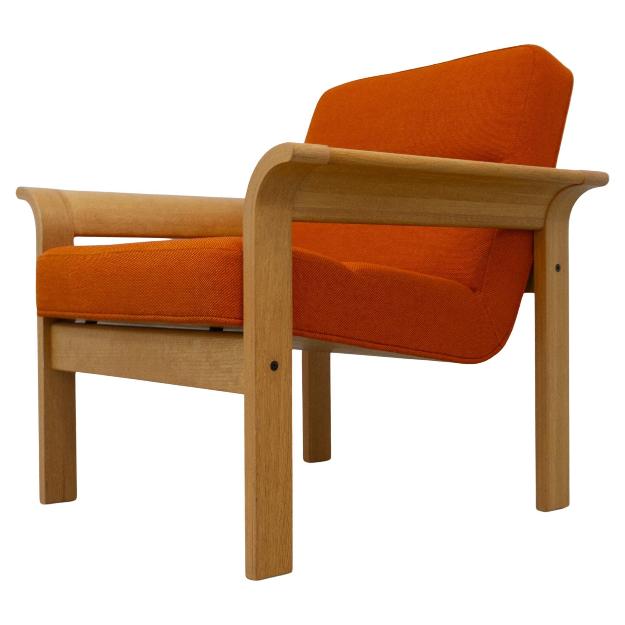 Danish Orange Oak Botium Lounge Chair by Magnus Olesen, 1970s.