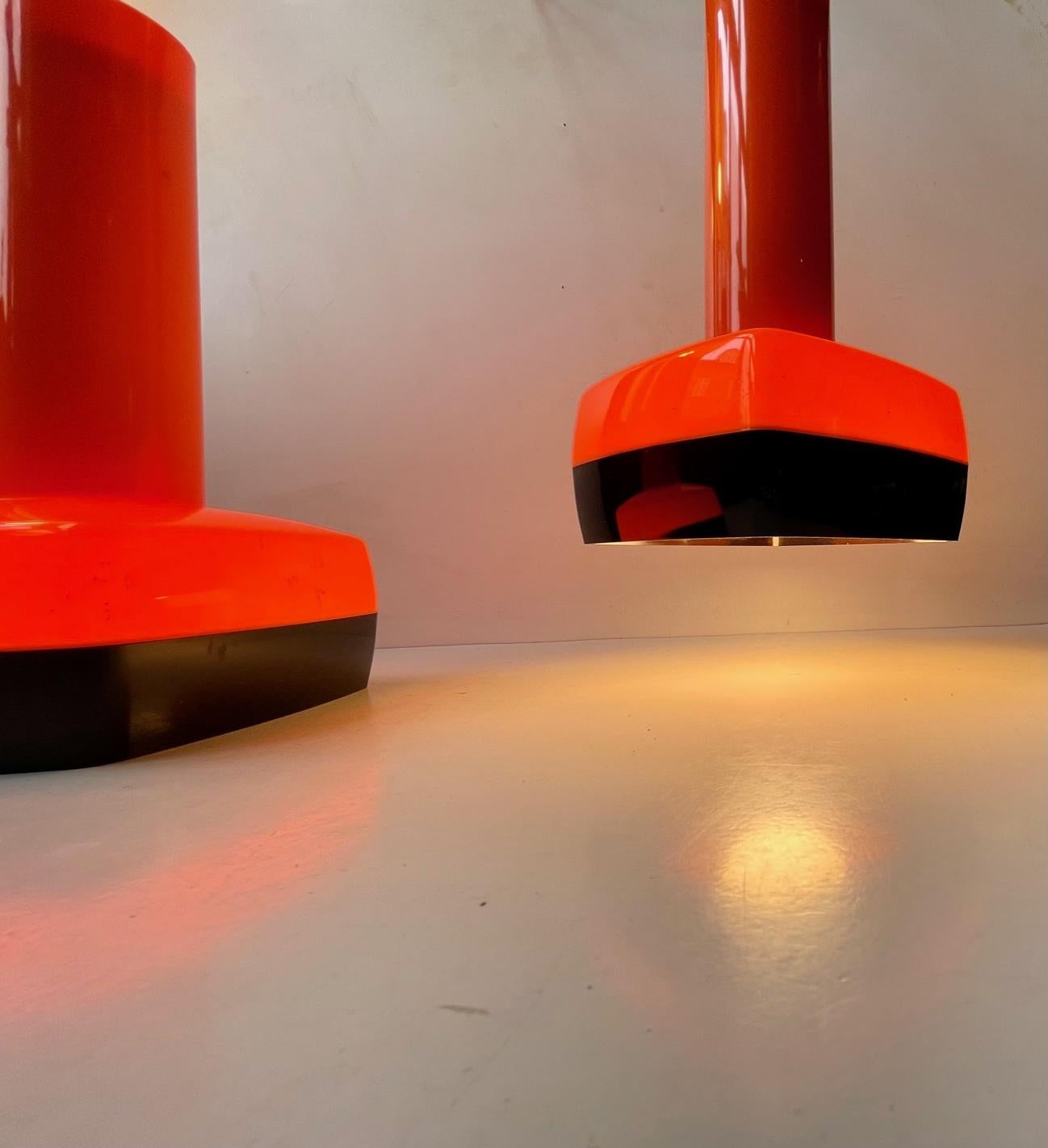 Acid - lava orange and black acrylic pendant lamps designed by Bent Karlby and manufactured by Ask Belysninger (A. Schrøder Kemi) in the 1970s in Denmark. A very rare and very wellkept pair. Measurements: H: 27 cm, W/D: 14 cm. The price is for the