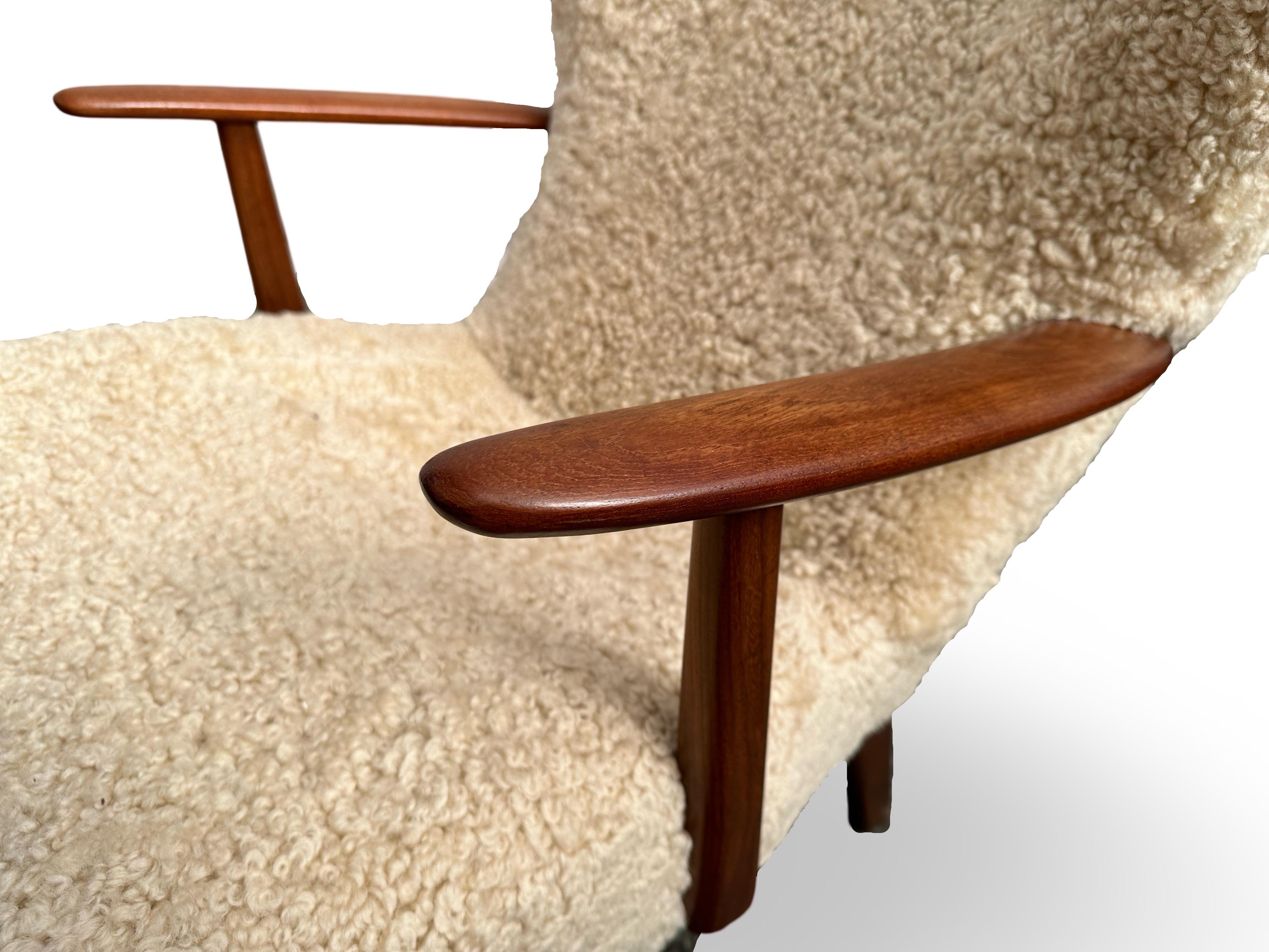 High back easy chair, model Pragstolen - designed by Henry Hans Schubell in 1961.
Manufactured by Madsen & Schubell, Denmark.
Seat height 42cm.
Stool measures 56x40x35cm.