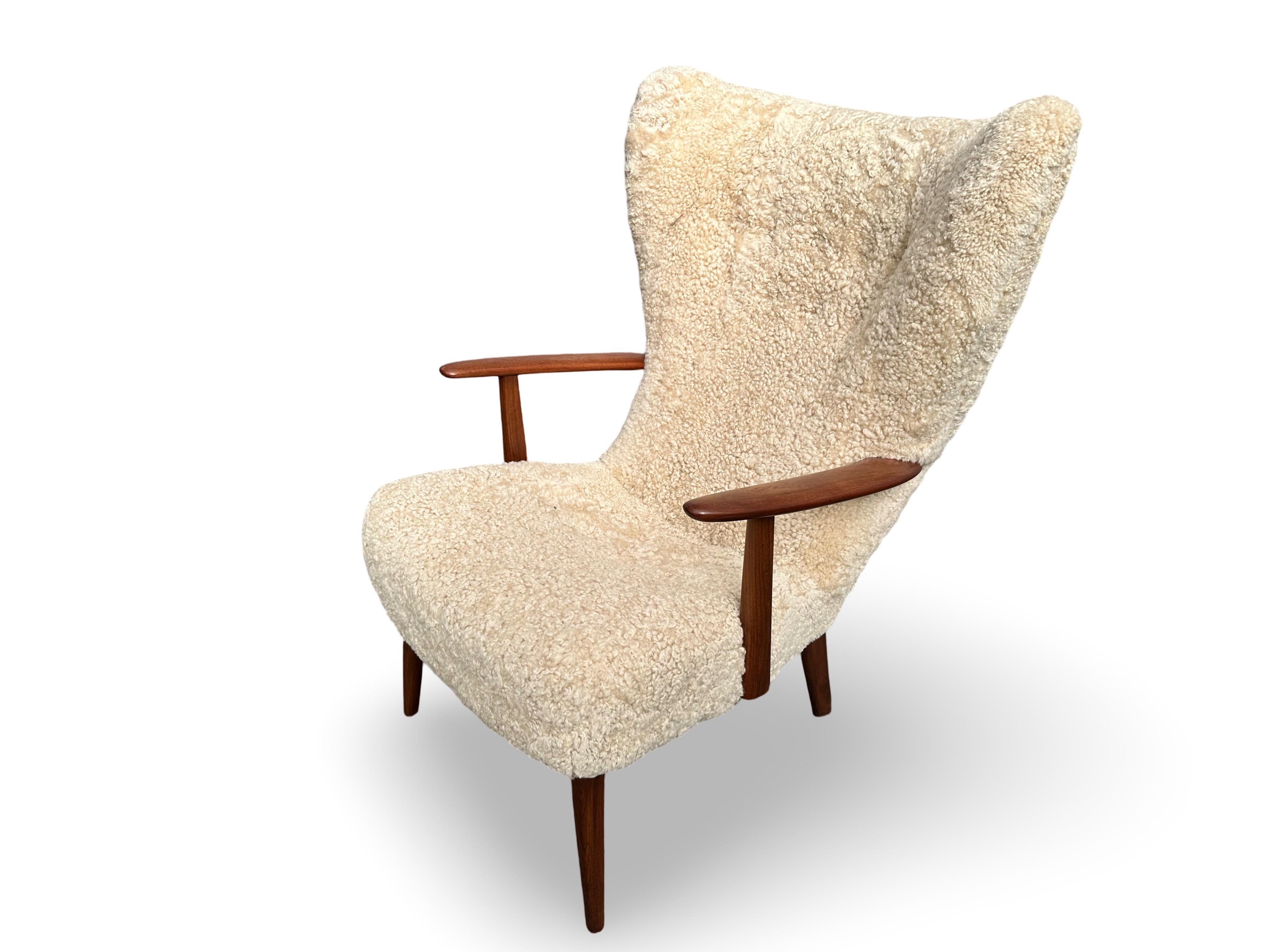 Sheepskin Danish original vintage lounge chair and stool by Madsen and Schubell, Denmark. For Sale