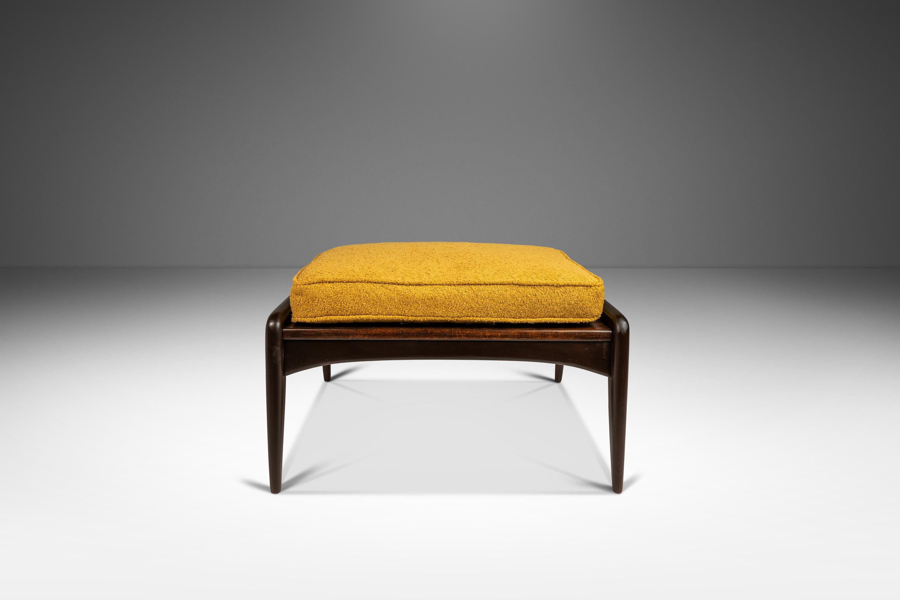 Introducing a true Danish Modern masterpiece: an ultra-rare footstool  designed by the incomparable Ib Kofod Larsen for Selig. This iconic ottoman, paired well with several Larsen armchairs including his 