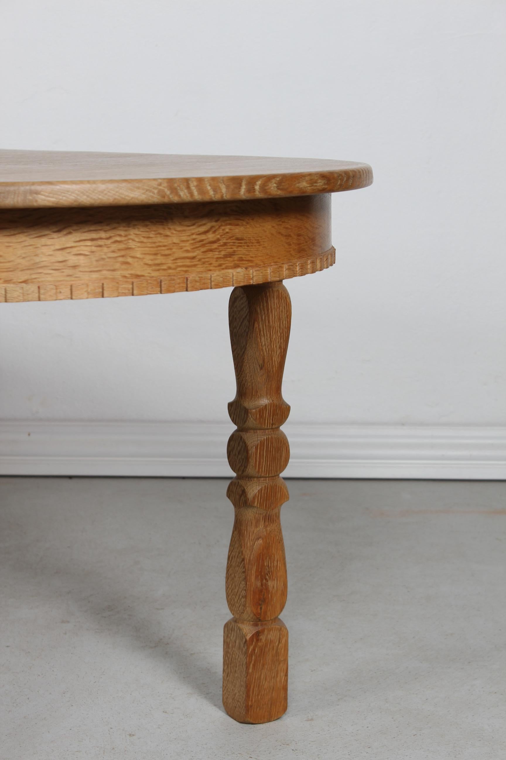 Danish Oval Extendable Dining Table of Oak in Henning  Kjærnulf Style 1970s For Sale 7