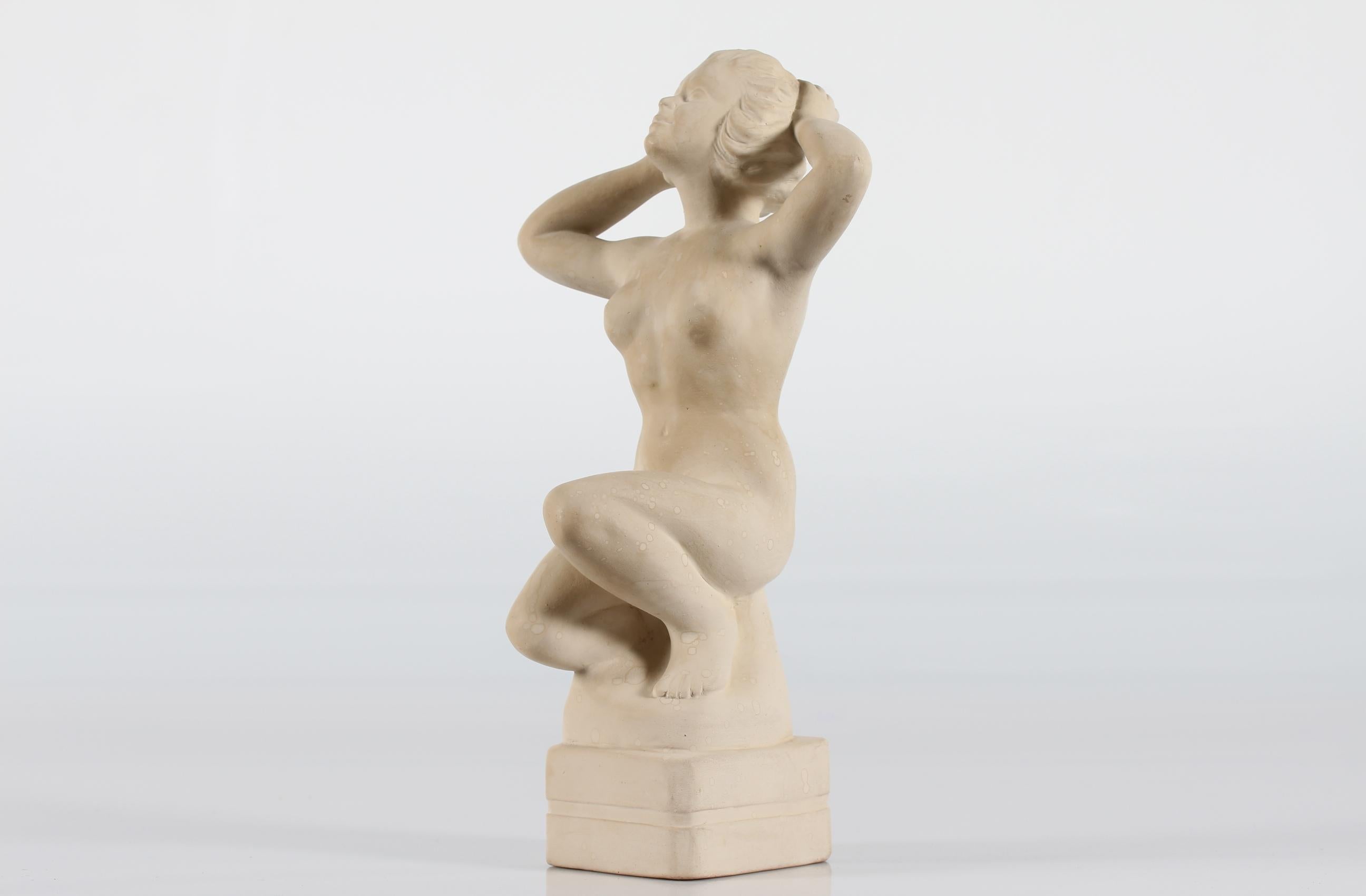 Ceramic figurine of a sitting young woman designed by Ove Fritz Rasmussen (1911-1973) 

The figurine is decorated with off white matte glaze and signed with the monogram OR

Measures: Height 38 cm
Width 20 cm

Nice vintage condition with
