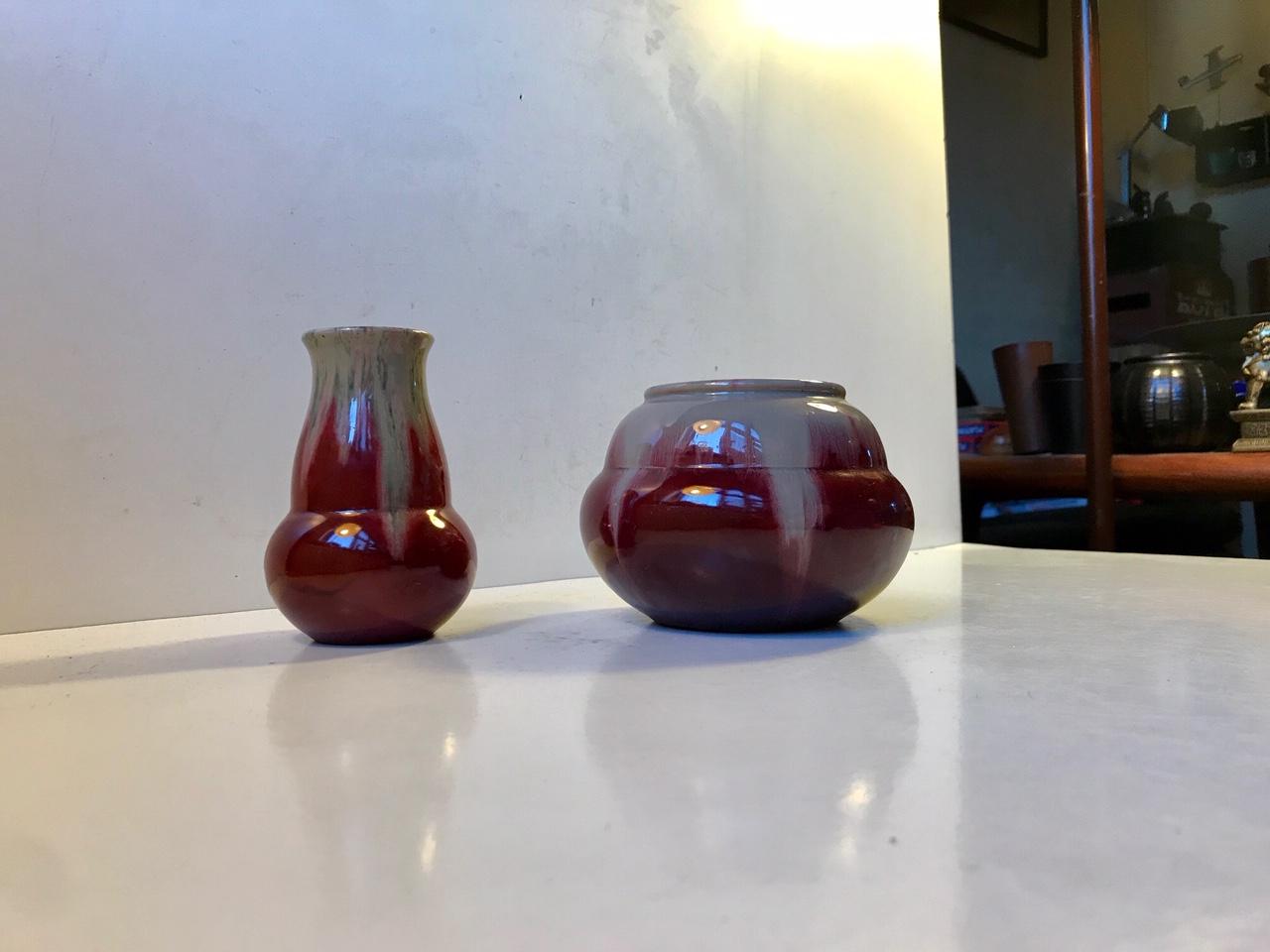 Danish 1930s ceramic vases displaying exceptional techniques in glazes, subtle Art Nouveau/Art Deco styling and shape. Michael Andersen's son Daniel won the Gold Medal at the World's Fair in Brussel in 1935. These pieces were designed by him.