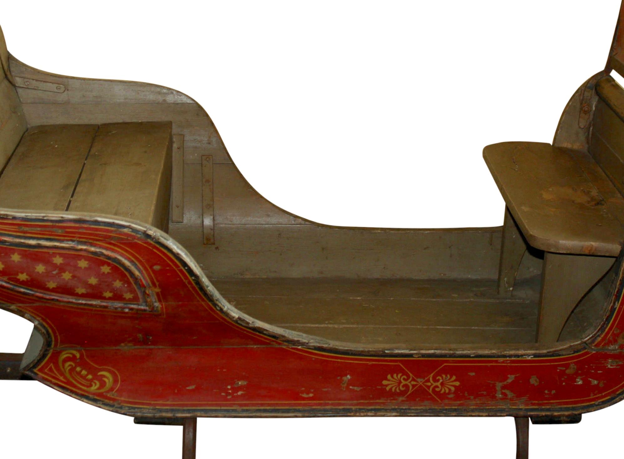 This 19th century, horse-drawn sleigh features traditional, Folk Art painting from Denmark. The wood runners have pinstriped, metal glides and hooks for connecting traces or tugs. Equipped with a front bench, rear bench, and rear saddle seat, the