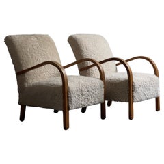 Pair 1930s Fritz Hansen danish modern Lounge Chairs in Sheepskin and Oak