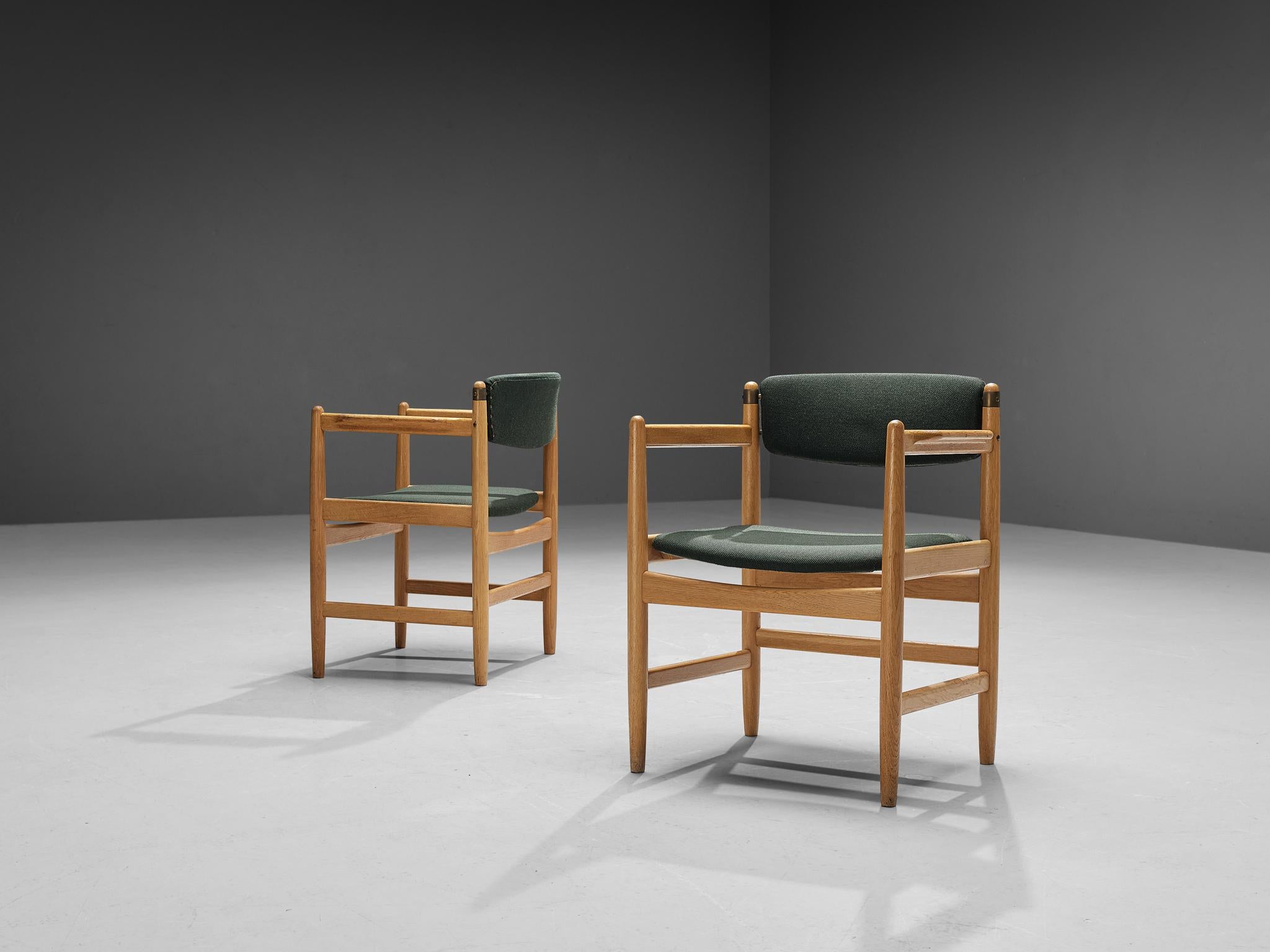 Pair of armchairs, fabric, oak, brass, Denmark, 1960s

This well-executed Danish pair of armchairs shows an exquisite level of craftsmanship. The chair features a sculpted frame that is typical for Mid-Century Scandinavian Modern design. The