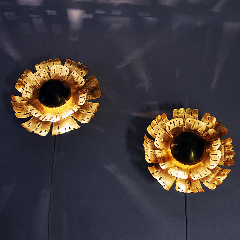 A stunning large pair of midcentury Danish Brutalist wall lamps designed in the 1960s by designer Svend Aage Holm Sørensen for Holm Sørensen & Co AS. These brass sconces has an acid-treated and torch-cut look in a Brutalistic design. They give a
