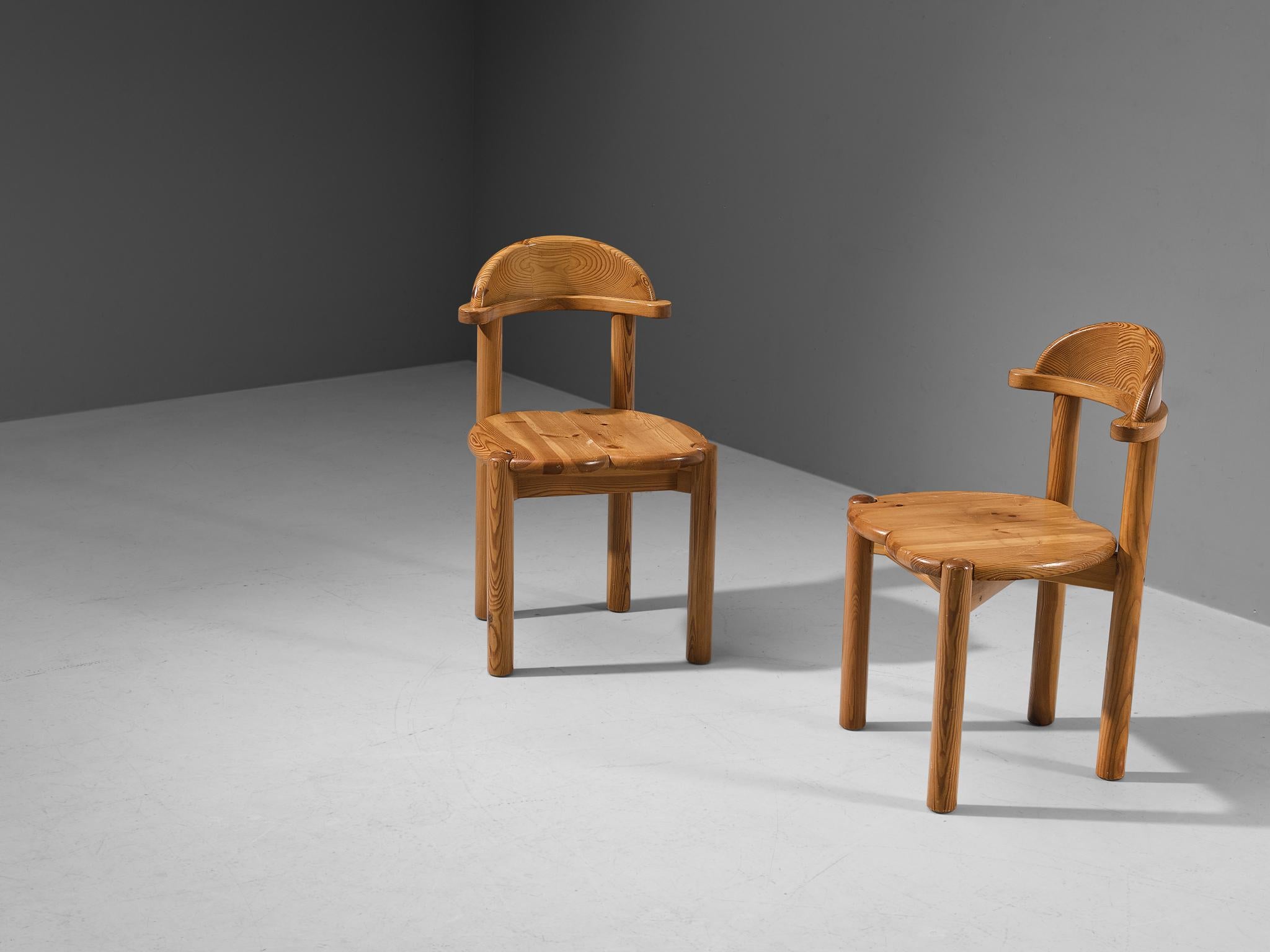 Dining chairs, pine, Denmark, 1970s. 

Pair of beautiful, organic and natural dining chairs in solid pine. A simplistic design with a round seating made of two wooden panels. A clear attention for the natural expression and grain of the wood is