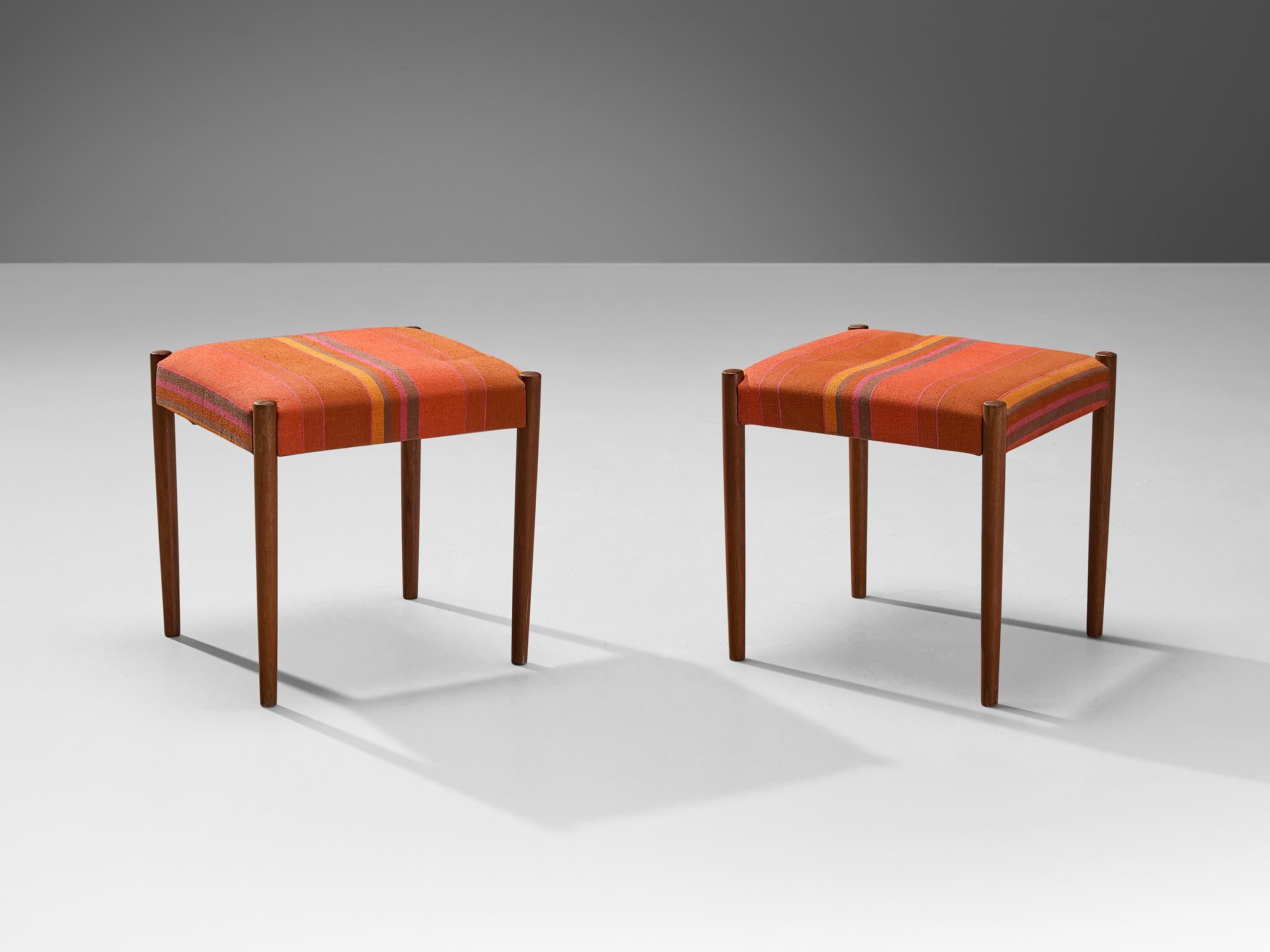 Pair of stools or ottomans, teak, fabric, Denmark, 1960s

Elegant in line and practical to use, these stools are exemplary for Mid-Century Scandinavian Design. The teak framework is comprised of four round legs that slightly narrow towards the