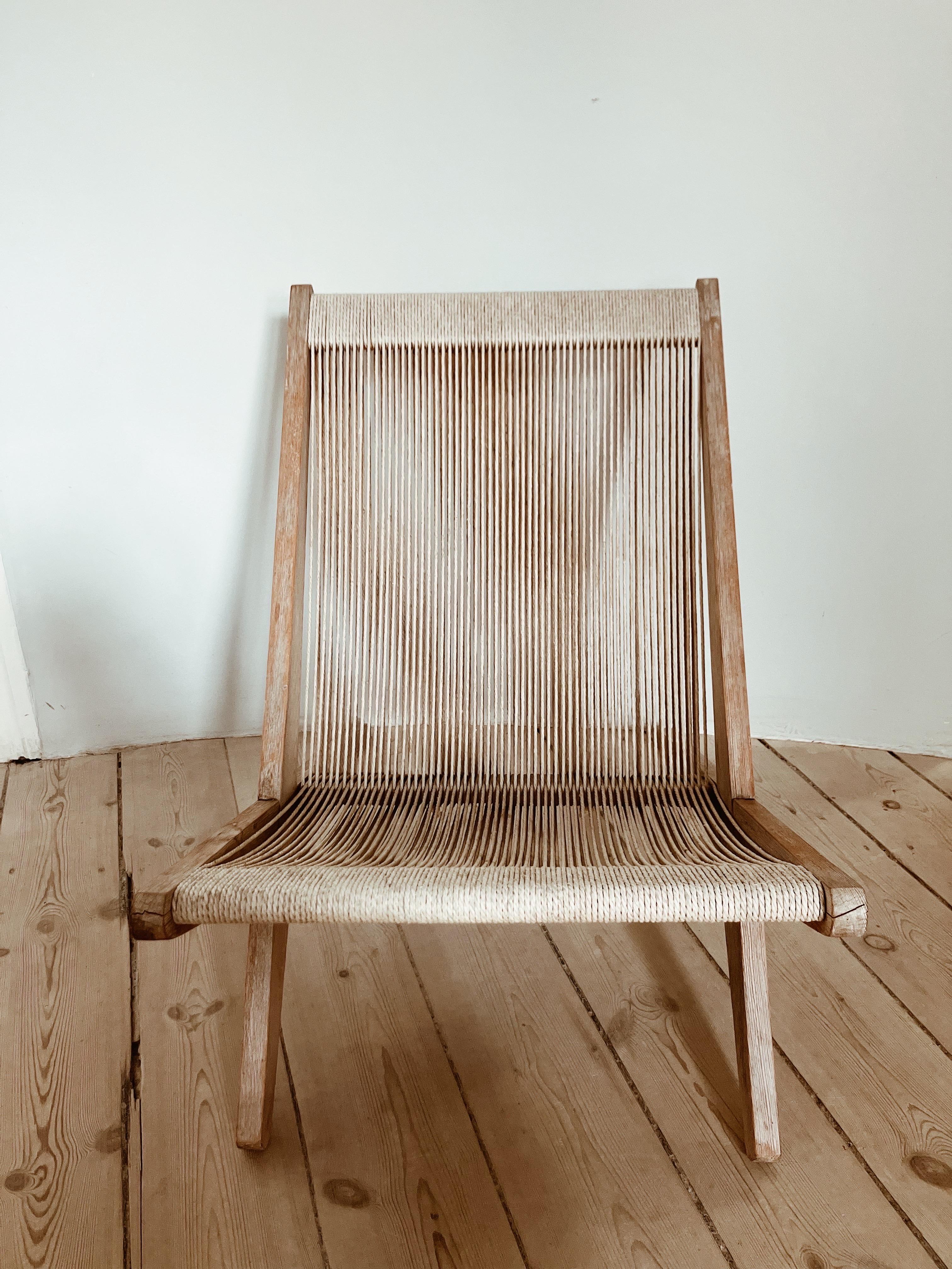 Danish lounge chair in pinewood and papercord, made in the style of Poul Kjærholm & Jørgen Høj (1952) 

This sculptural chair is probably made in the 70’s and the elegant pine wood frame and papercord is in a good condition. The chair is stable. 


