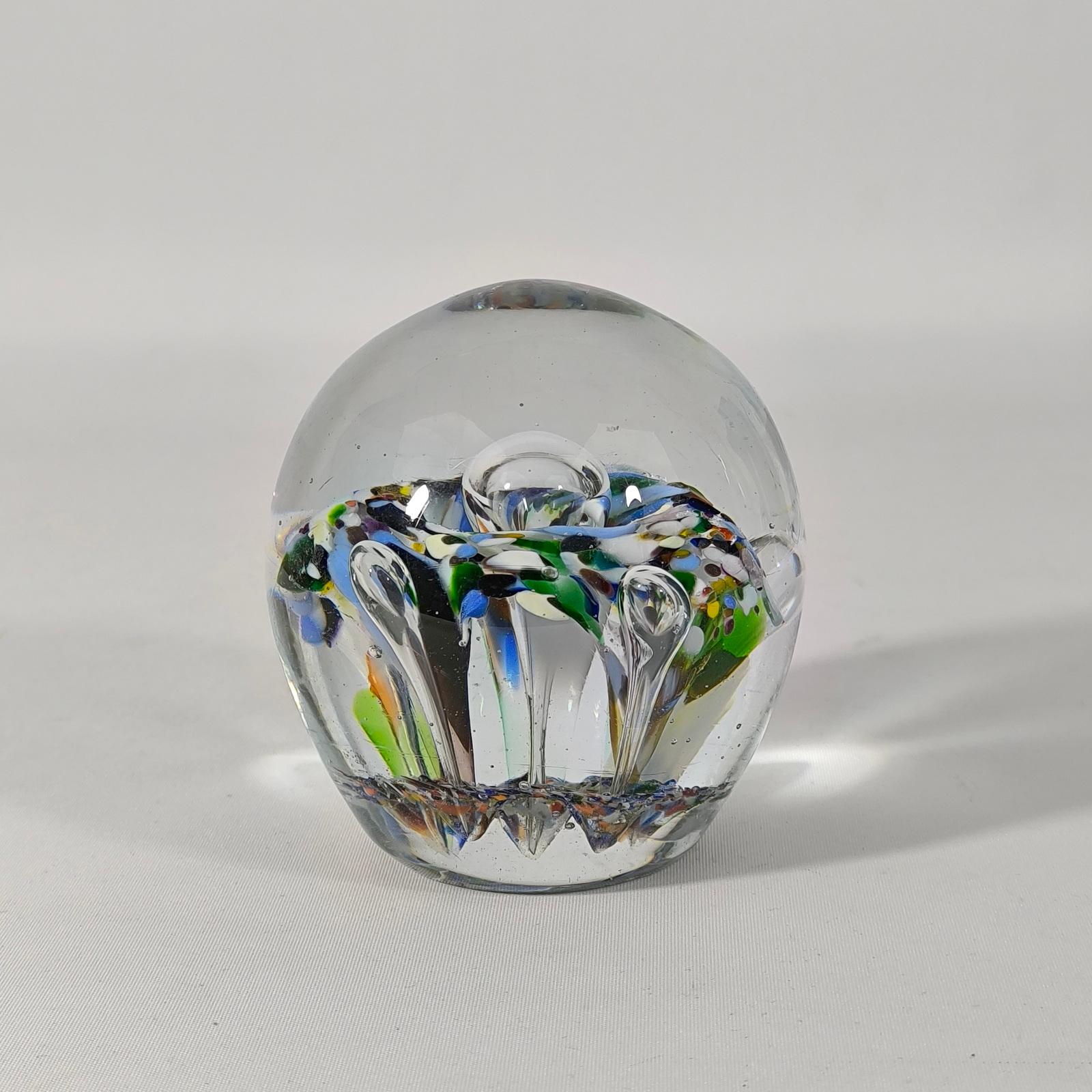 Large glass paperweight, early 20th Century. Denmark. 
Clear glass mass with internal air bubbles and colored glass. 
In excellent condition.

Dimensions:
Height: 10 cm. Diameter: 8.5 cm.