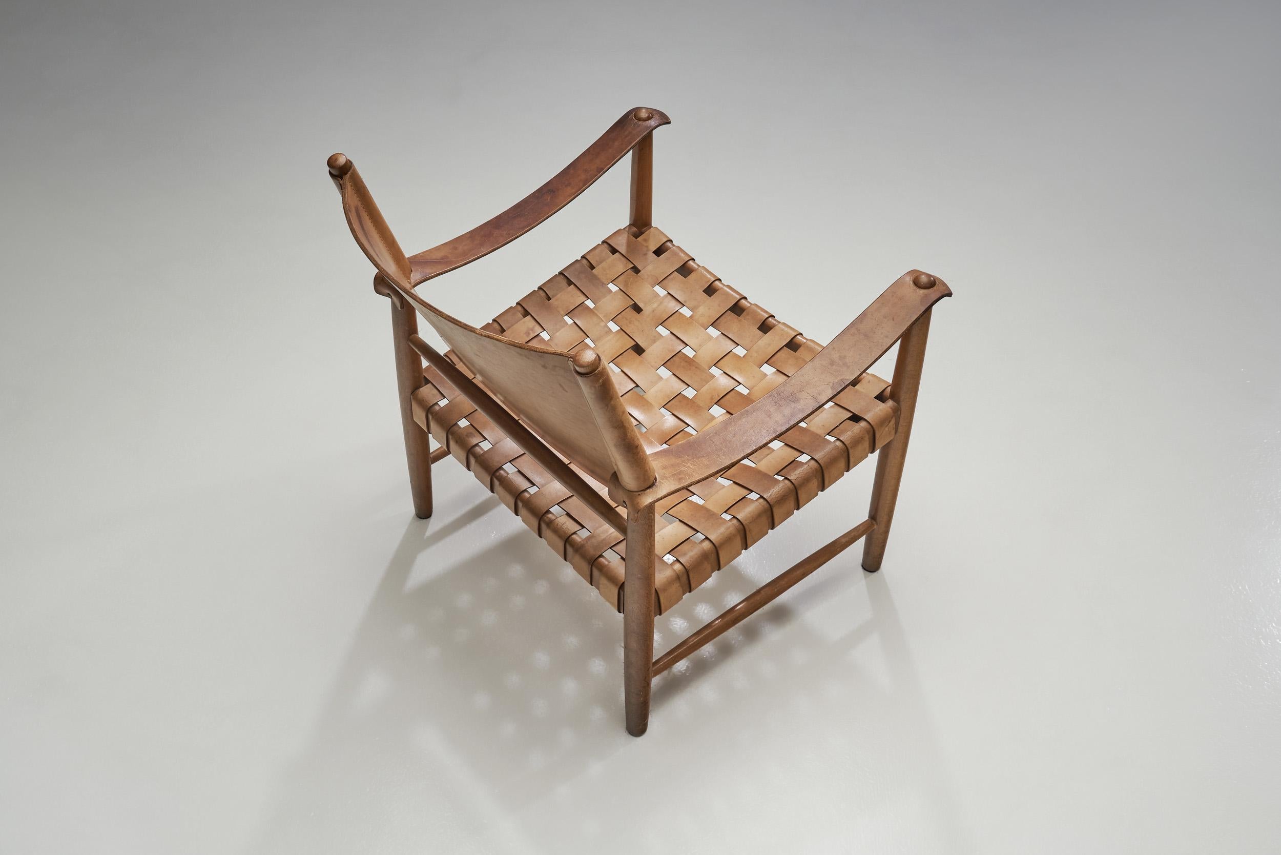 Scandinavian Modern Danish Patinated Leather Safari Chair, Denmark, ca 1960s For Sale