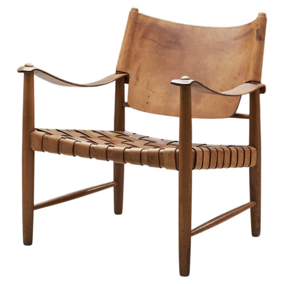 Danish Patinated Leather Safari Chair, Denmark, ca 1960s For Sale