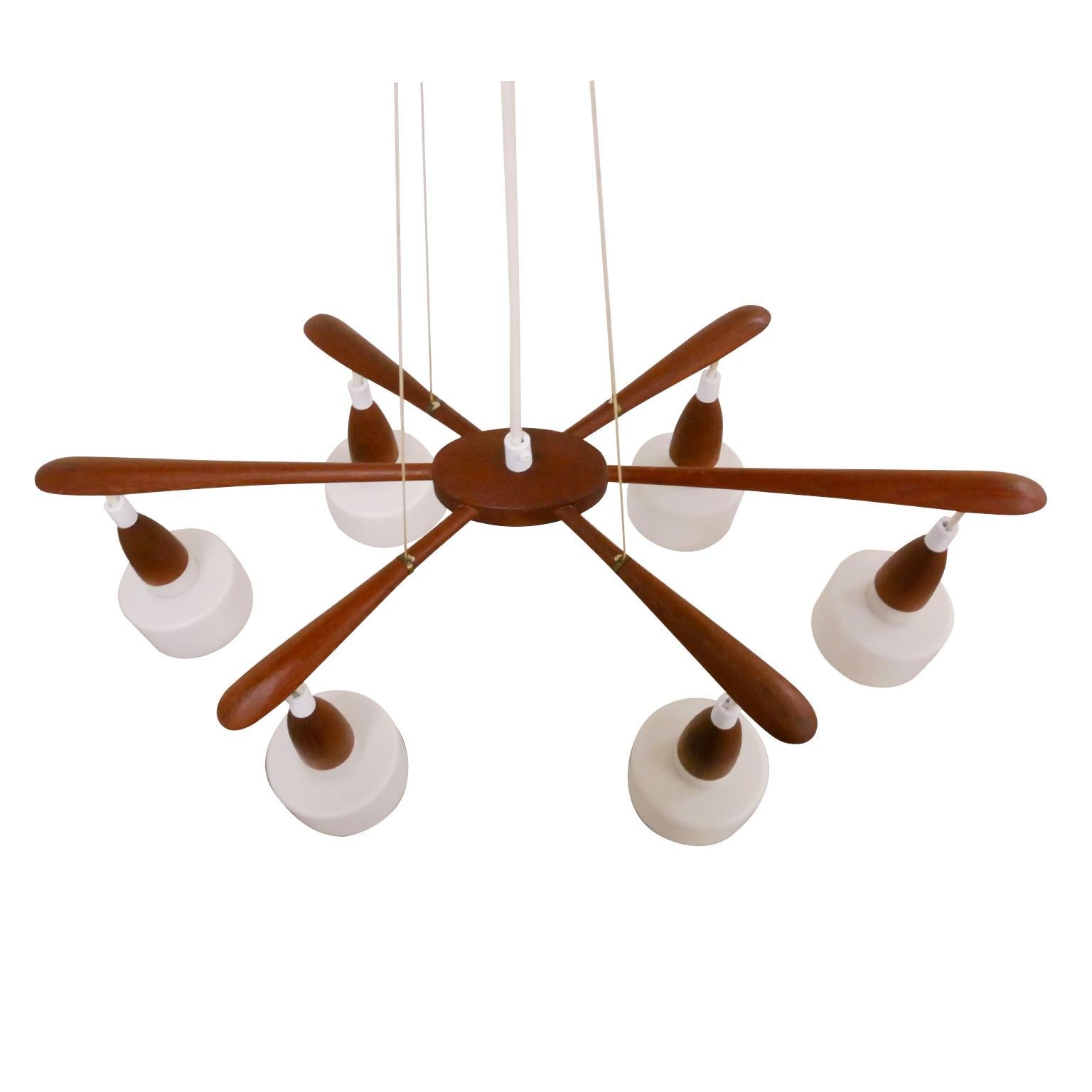 Midcentury Danish pendant lamp in teak and Opaline glass. Very good craftsman ship.
        