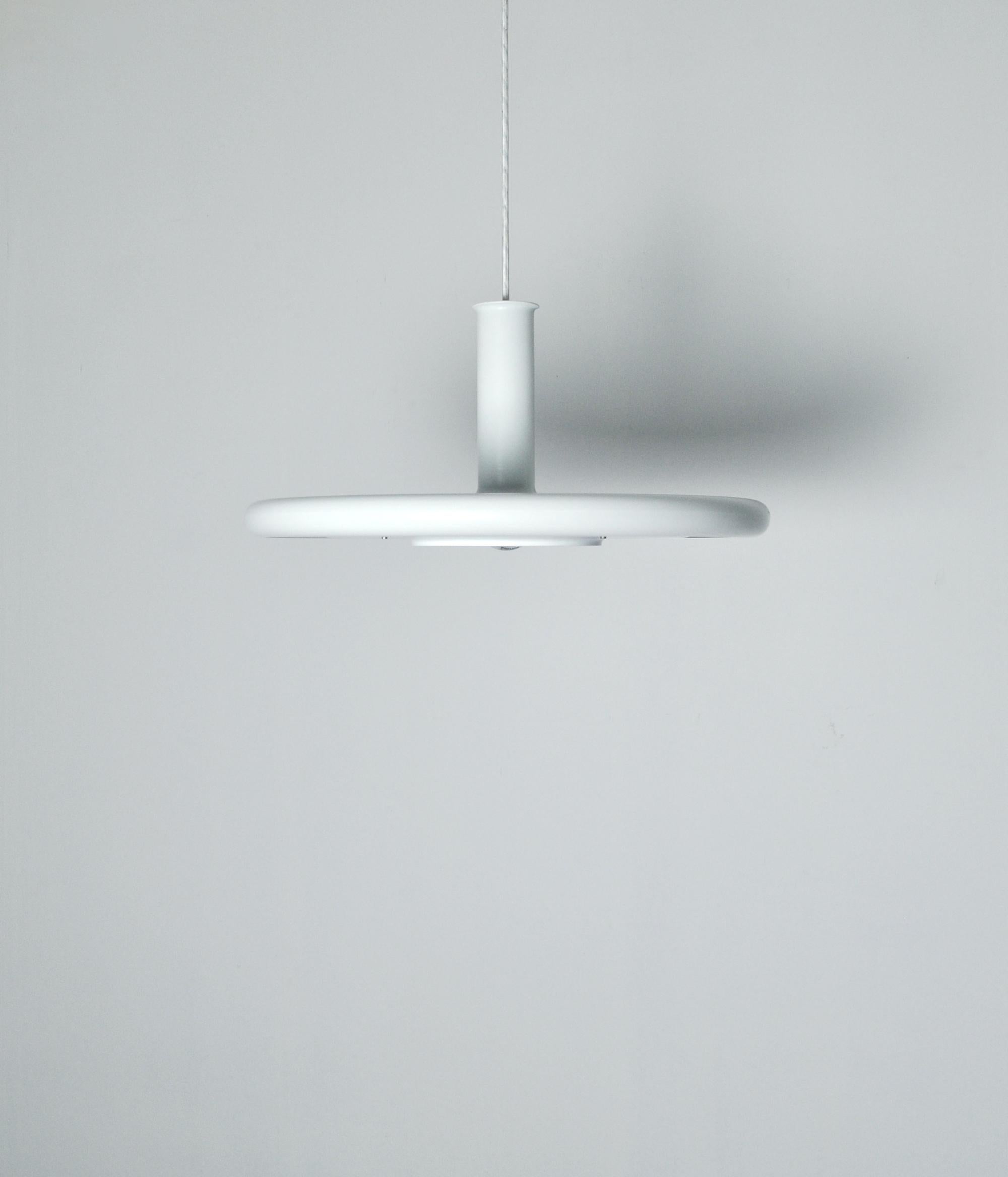 Danish pendant by Fog & Mørup, model 'Optima'. Design Hans Due. 
Pendant in white metal, white and red inner shade. Optima is specially designed for silver bulbs, thus obtaining the flattest possible fitting, where the shade covers only a minimum