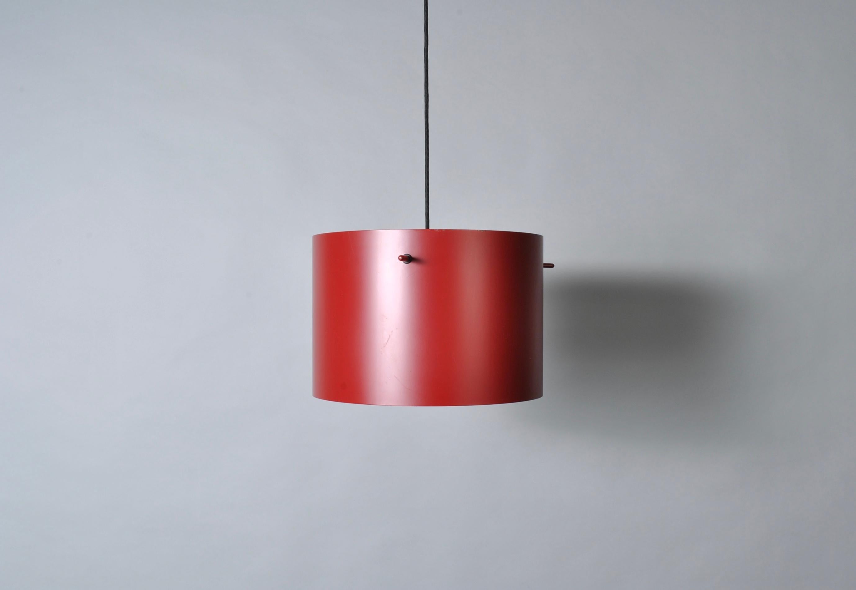 A lovely pair of cylindrical bright red pendants, model FM1954, designed by the Danish architects Knud Friis and Elmar Moltke Nielsen in 1954. They were manufactured by Lampas during the 1970s. Made with aluminium and steel.
Very good quality