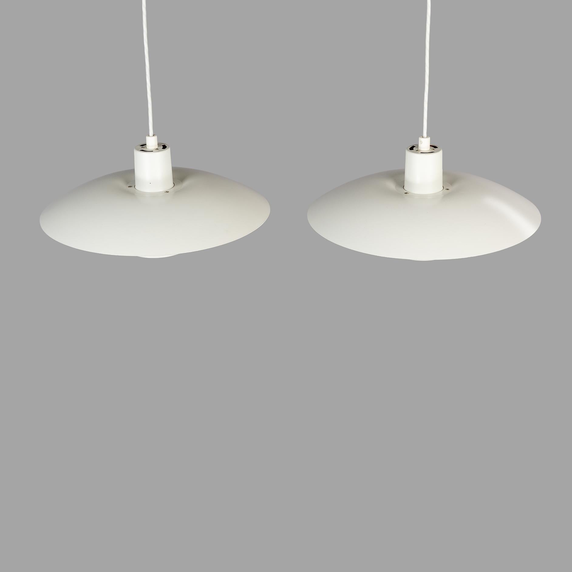 Pair of Louis Poulsen PH 4/3 lamps designed by Poul Henningsen in 1966. This set dates from a production series in the mid 70s and is made of powder coated aluminum. Overall condition is very good. The PH 4/3 was Henningsen last design for Louis