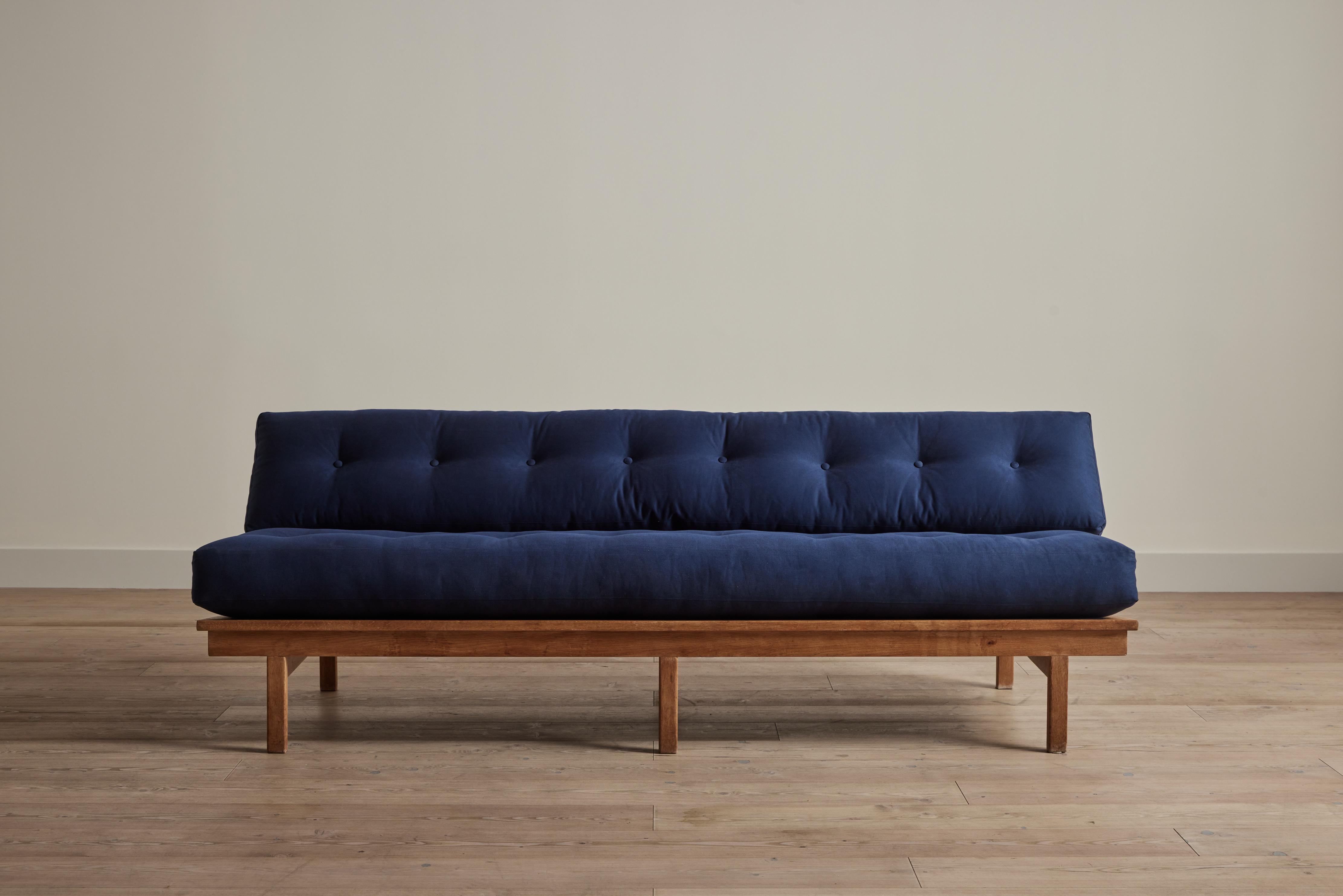 Large 1950s pine frame sofa from Denmark with new cushions upholstered in Nickey Kehoe’s cotton twill in Navy. There is some wear on wood that is consistent with age and use. 