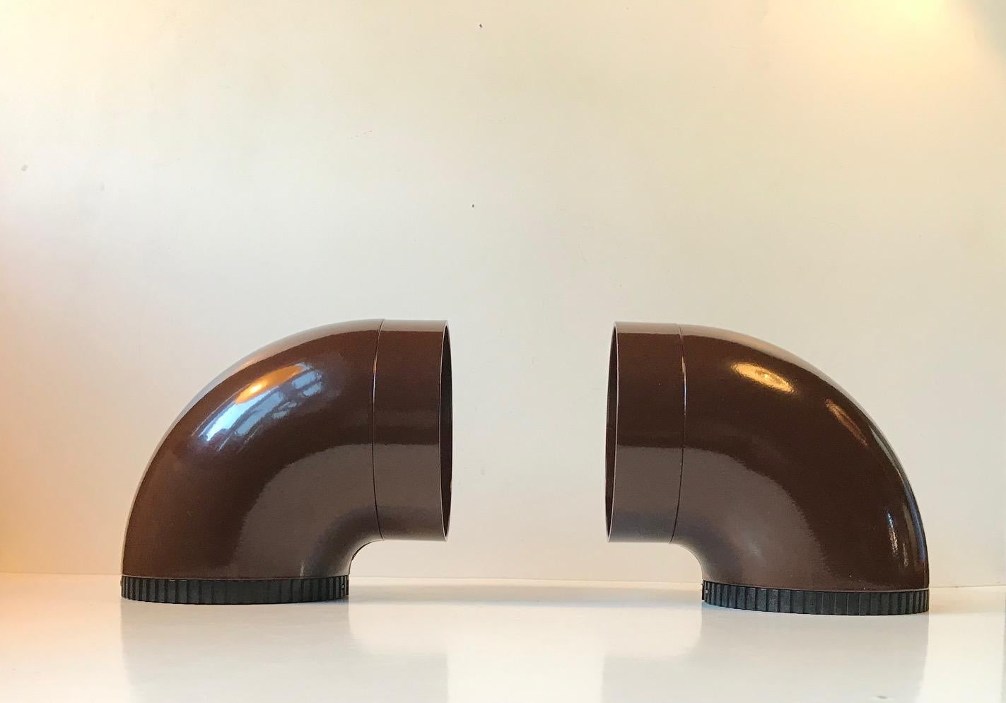 This is a pair of wall sconces by the Danish architect Ole Pless. They were manufactured by Nordisk Solar Kompagni in Denmark during the 1970s. The lights is for indoor as well as outdoor use. These lights have never been installed or used and one
