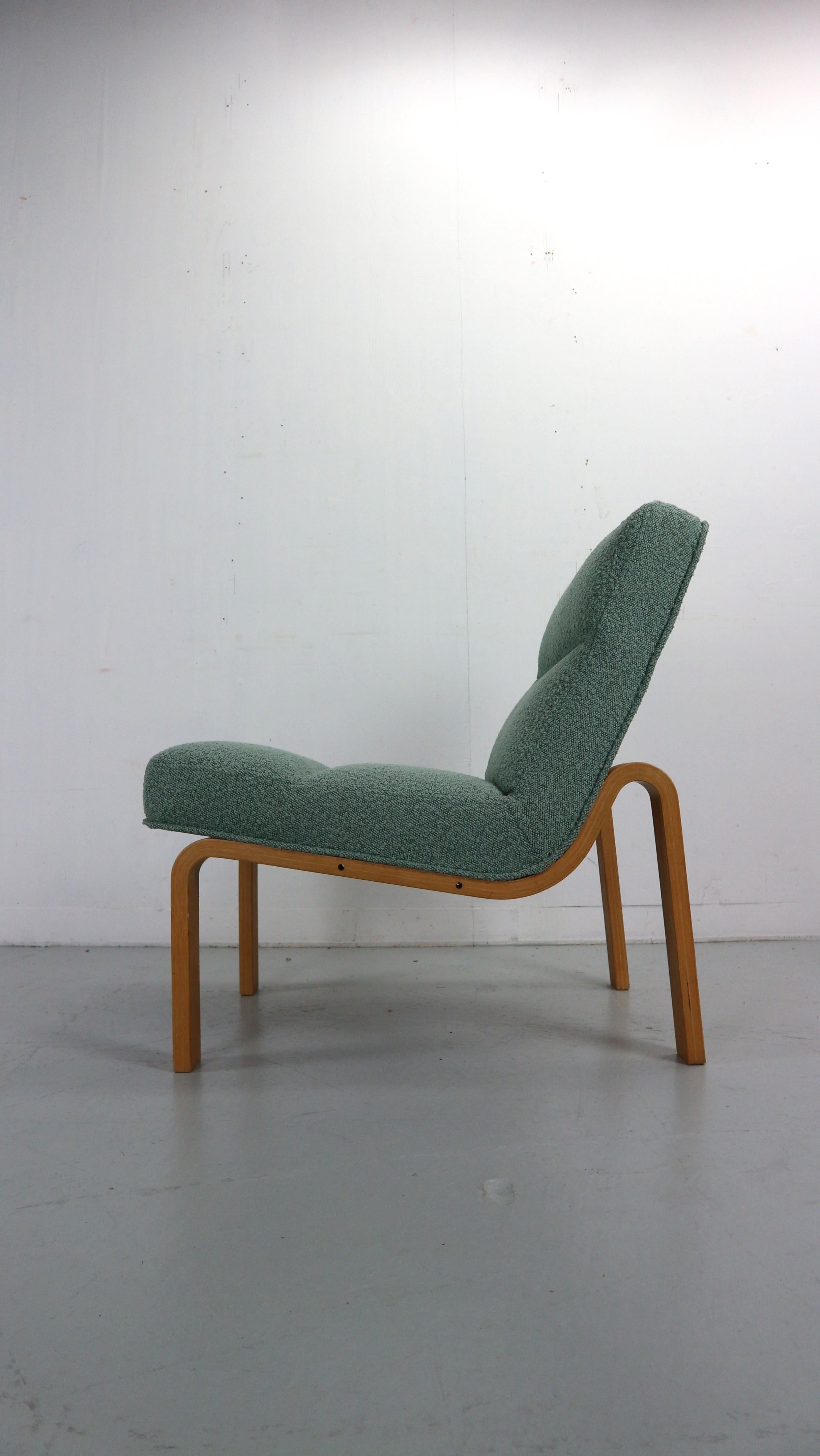 Mid-Century Danish  lounge chair
Designed by Magnus Olesen. Denmark, 1970s
Plywood beech bended seating construction with beautiful  high quality bouclé fabric upholstery.
The chair is in a very good condition.
The frame has holes on the side frame