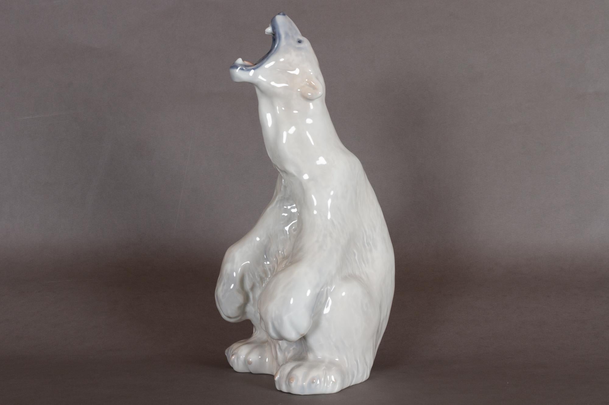 Danish porcelain polar bear sculpture by C. F. Liisberg for Royal Copenhagen, 1970s.
Large polar bear figurine in porcelain by Carl Frederik Liisberg for Danish manufacturer Royal Copenhagen. Designed in 1901, this example was made between 1975 and